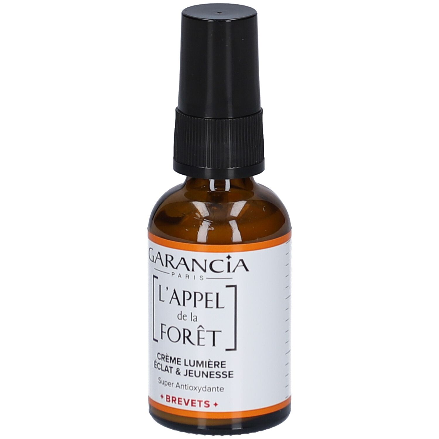 Flacon en verre brun avec pompe noire. Étiquette avec texte: GARANCIA, L'APPEL de la FORÊT, Crème Lumière, Éclat & Jeunesse, Super Antioxydante.