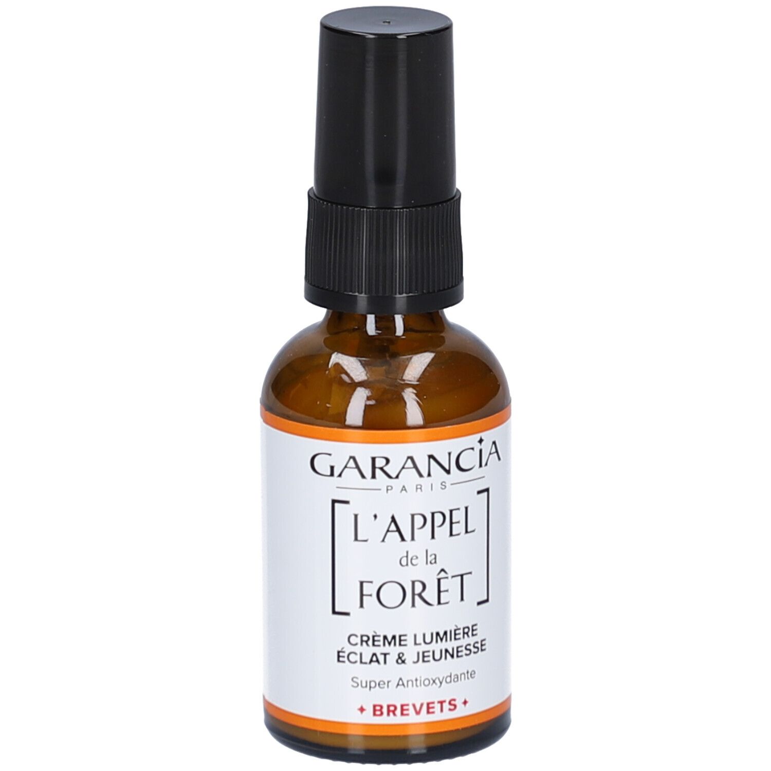 Flacon en verre brun avec pompe noire. Étiquette avec texte: GARANCIA, L'APPEL de la FORÊT, Crème Lumière, Éclat & Jeunesse, Super Antioxydante.