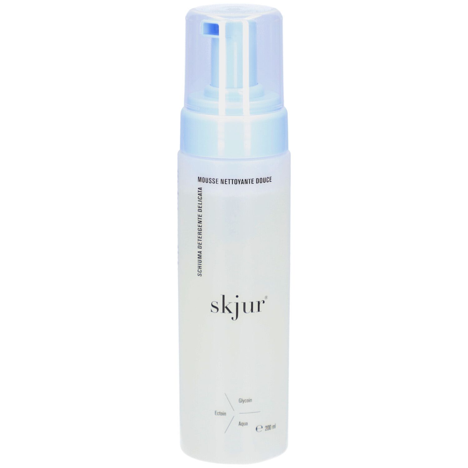 Flacon blanc avec pompe bleue. Inscription: skjur. Texte: Mousse nettoyante douce, Schiuma detergente delicata.