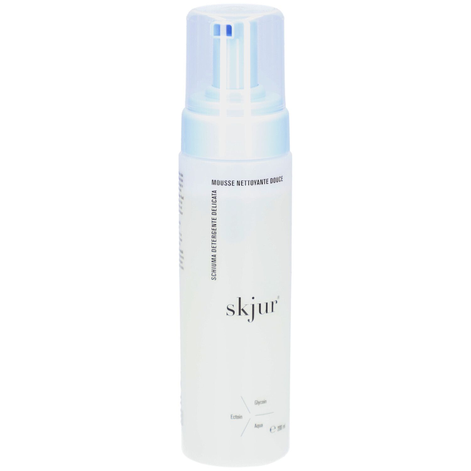 Flacon blanc avec pompe bleue. Inscription: skjur. Texte: Mousse nettoyante douce, Schiuma detergente delicata.