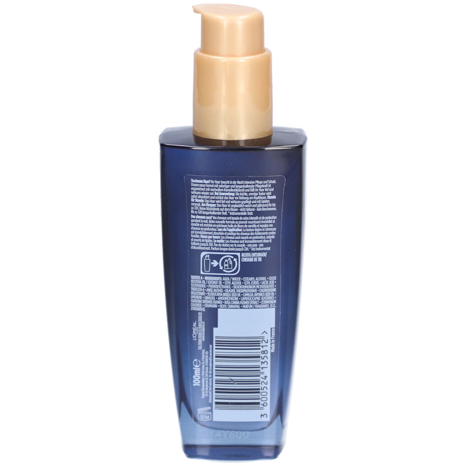 Rückseite der dunkelblauen Flasche mit Text und Barcode. Goldfarbener Pumpkopf.