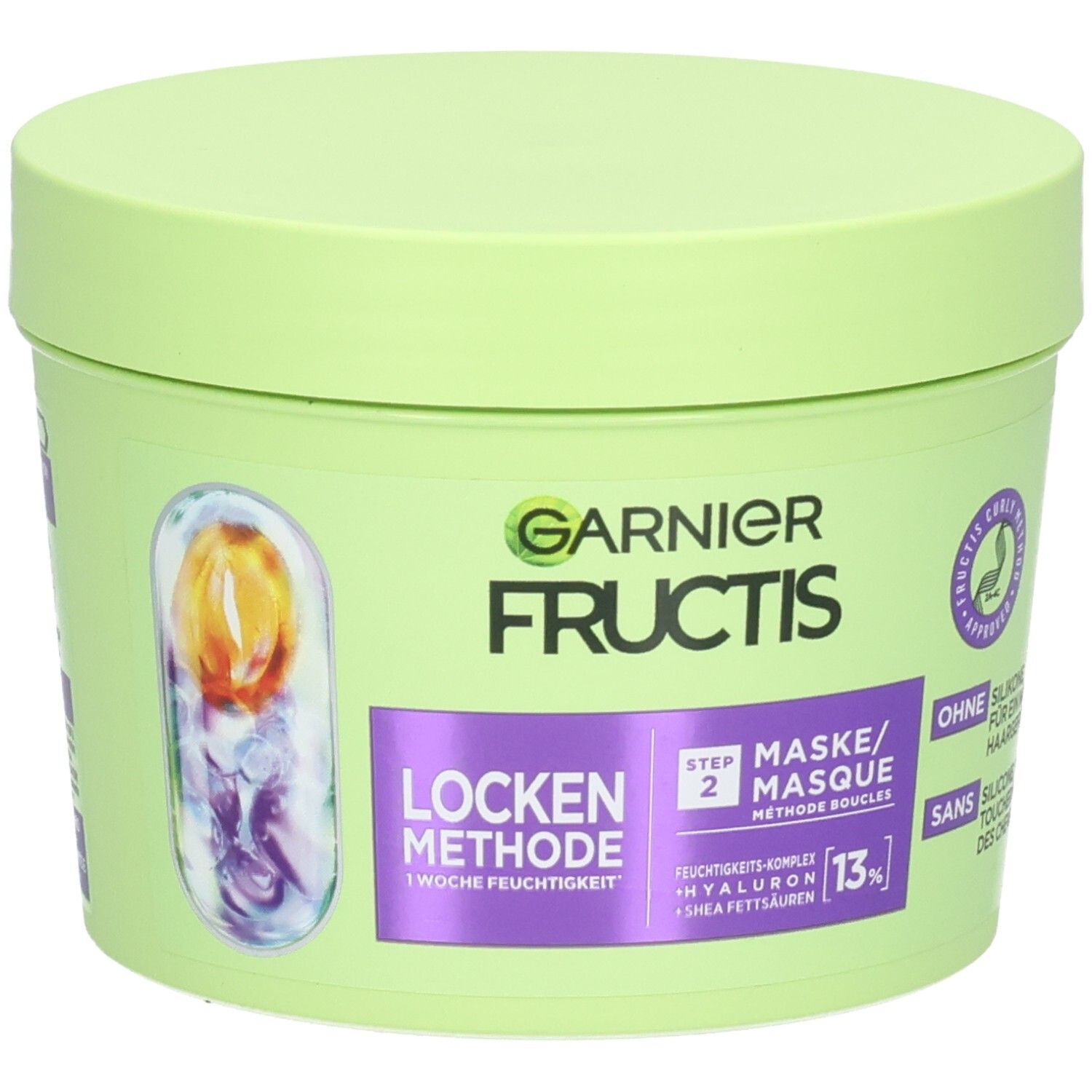 Grüner Tiegel mit Deckel. Aufschrift: GARNIER FRUCTIS, Locken Methode, Step 2 Maske. Enthält Hyaluron und Sheabutter.