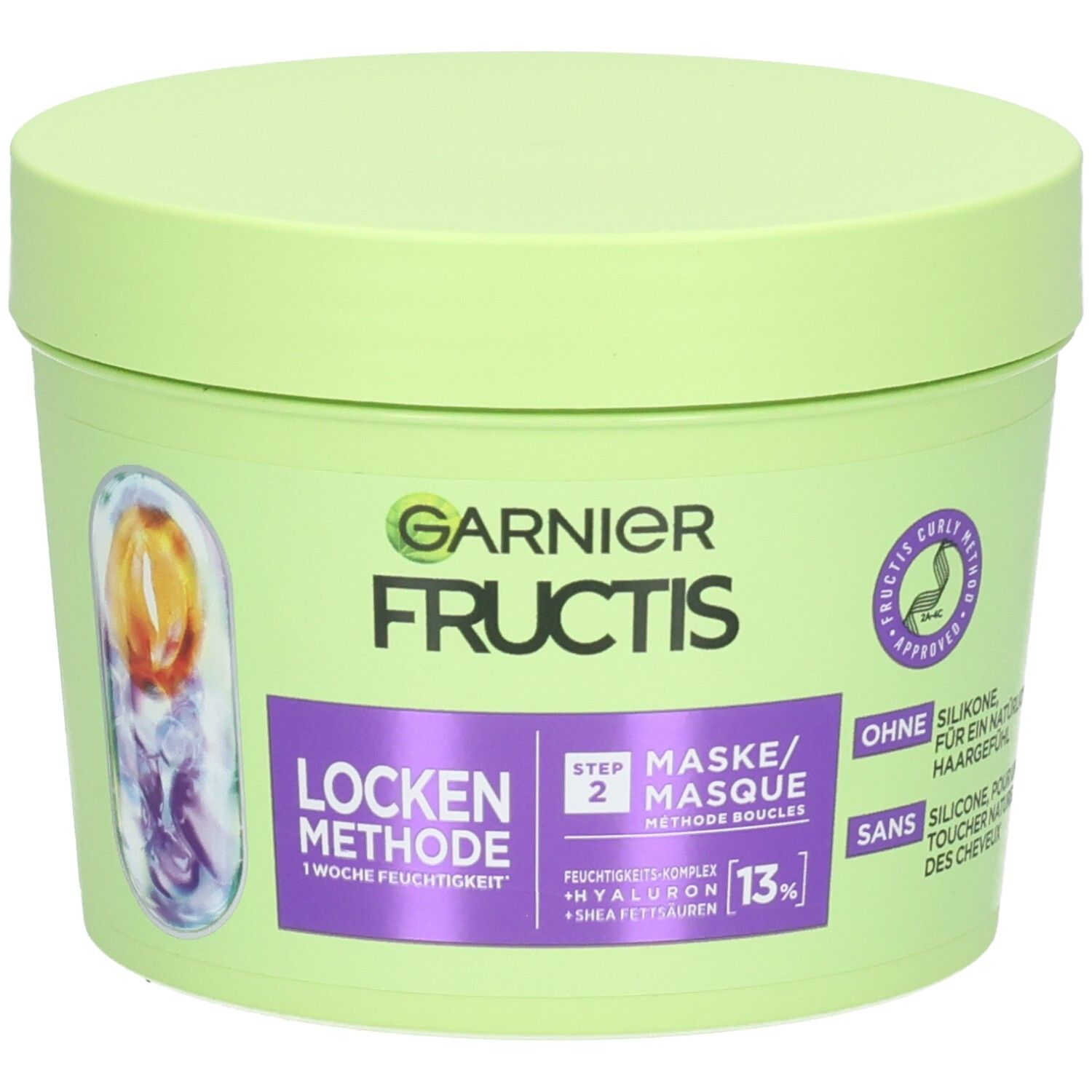 Grüner Tiegel mit Deckel. Aufschrift: GARNIER FRUCTIS, Locken Methode, Step 2 Maske. Ohne Silikone.