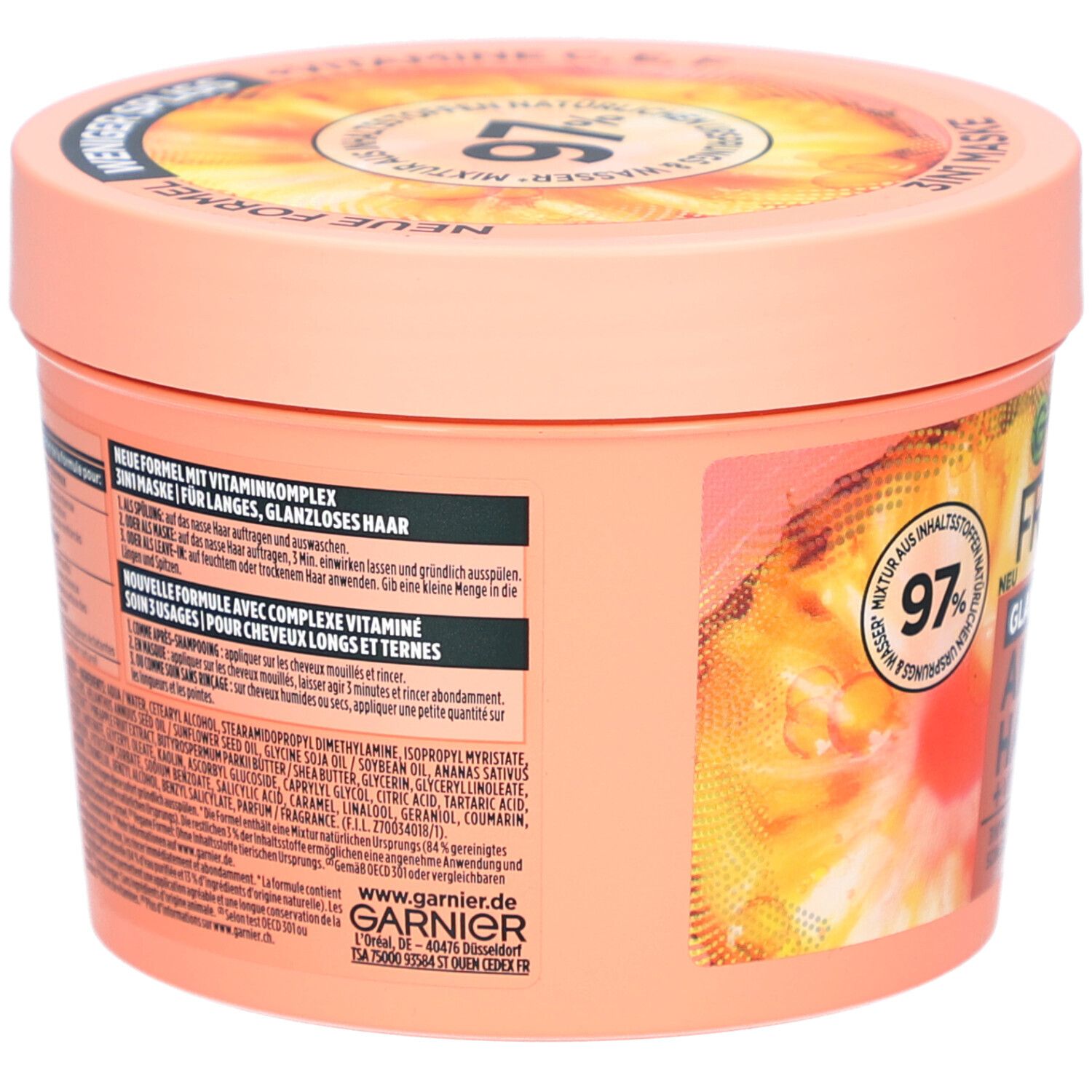 Runde Dose, Rückseite, mit Text. Garnier Fructis Hair Food Ananas. Aufschrift: Neue Formel, mit Vitaminen.
