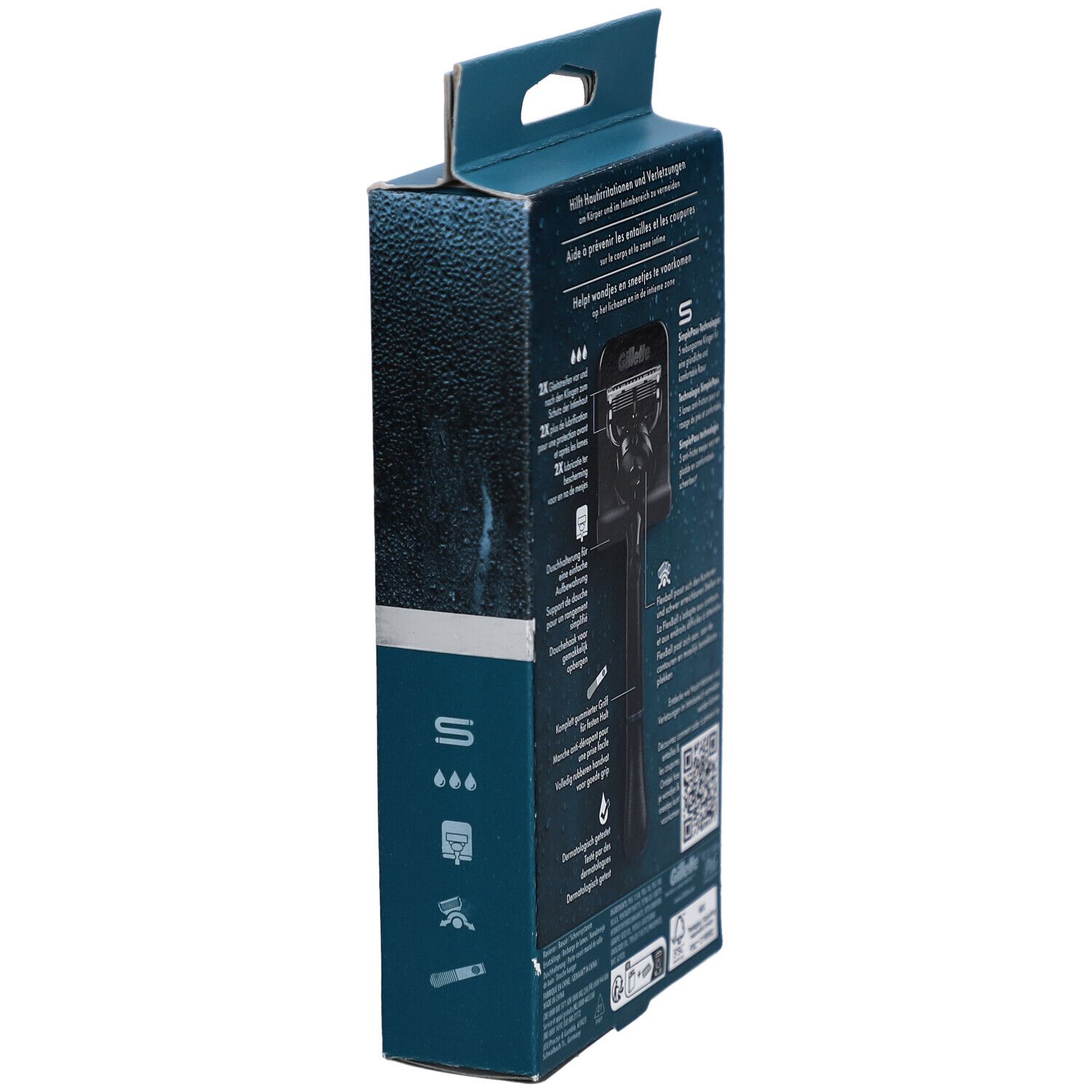 Vue latérale de l'emballage. Texte: Gillette. Rasoir corps & zone intime. Avec code QR.
