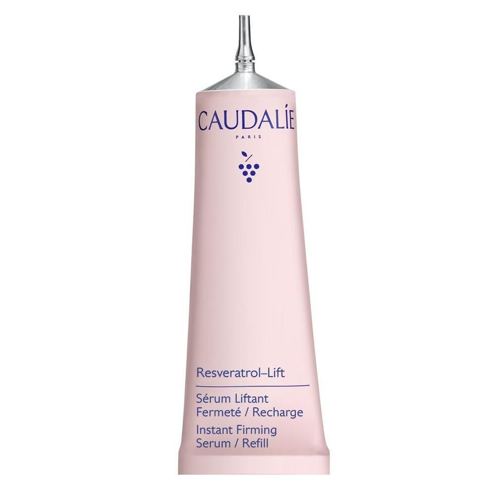 Tube rose avec embout argenté. Logo CAUDALIE et grappe de raisin. Texte: Resveratrol-Lift, Sérum Liftant, Instant Firming Serum.