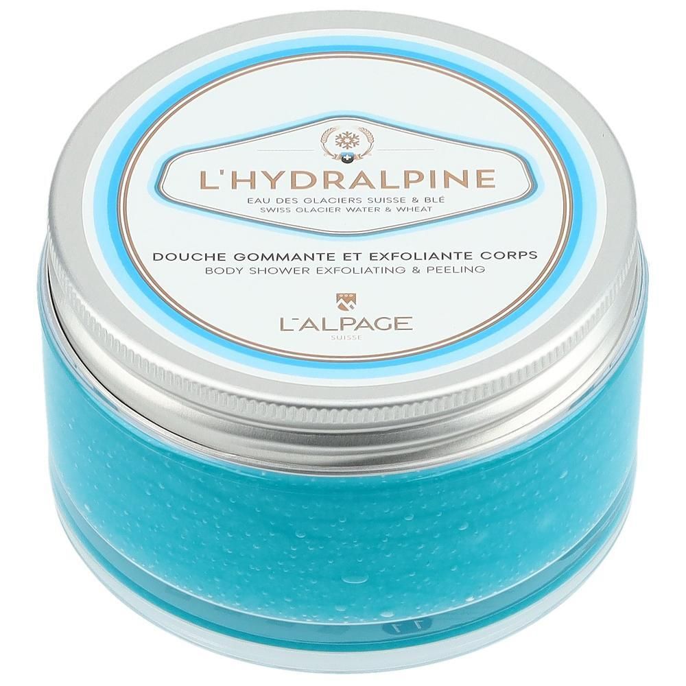 Pot rond de gommage bleu. Couvercle avec texte L'Hydralpine et informations produit. Couvercle argenté.