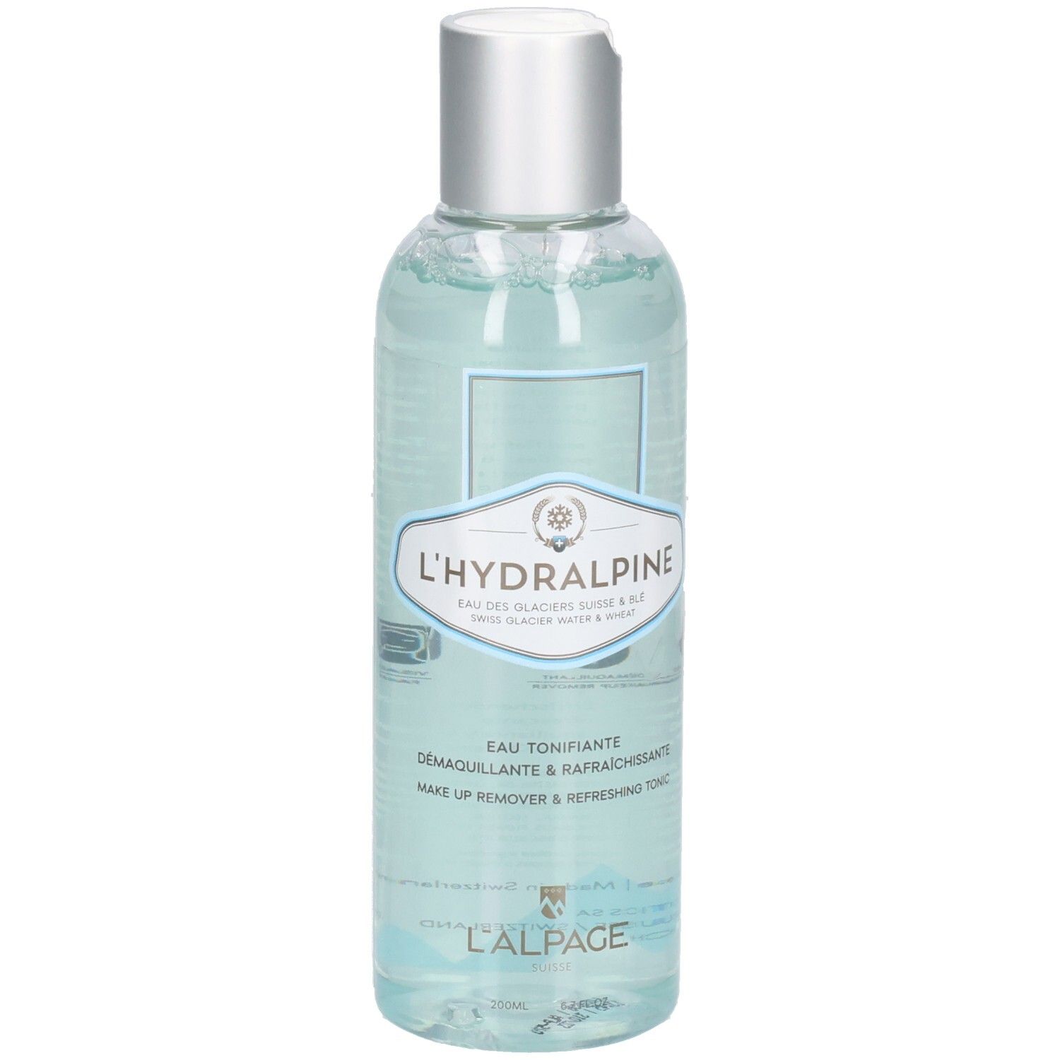 Klare Flasche mit silbernem Deckel. Etikett mit Produktnamen L'Hydralpine und Text. Blaue Flüssigkeit sichtbar.