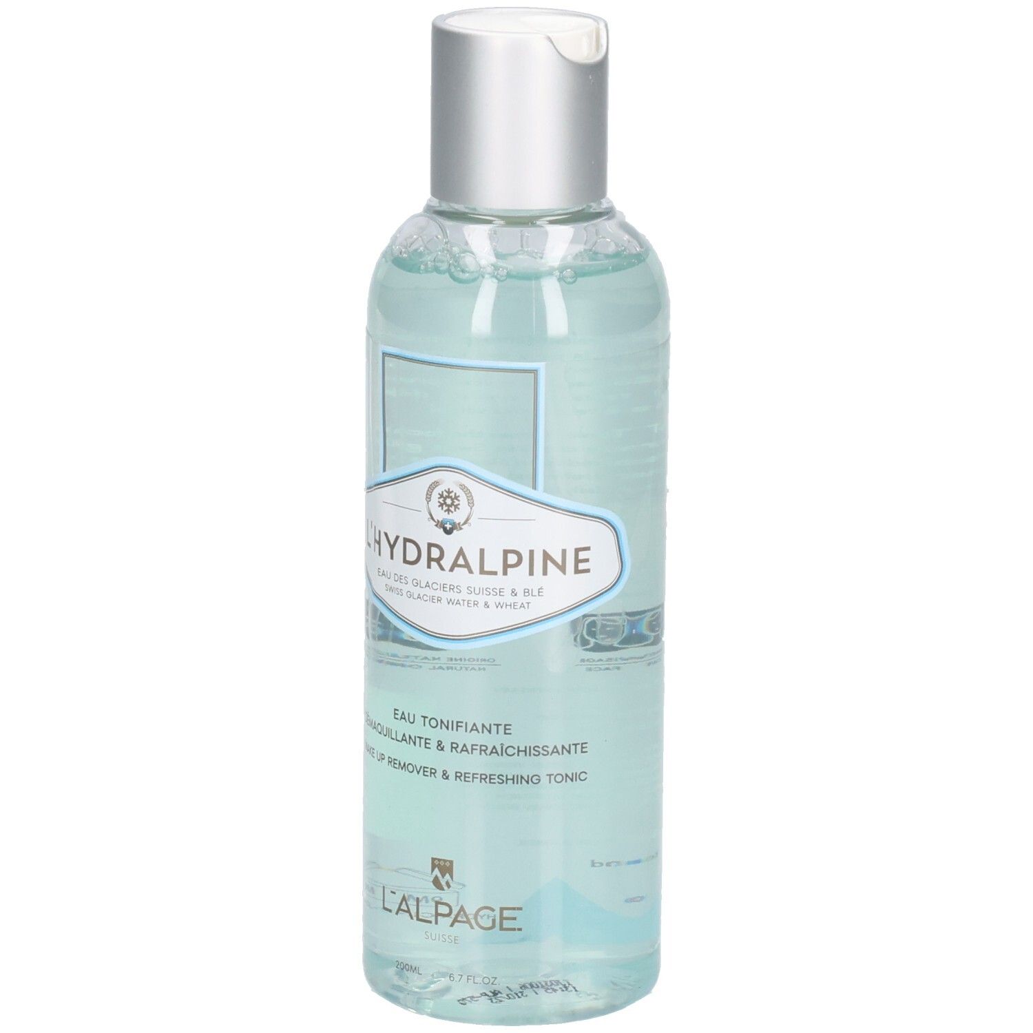 Klare Flasche mit silbernem Deckel. Etikett mit Produktnamen L'Hydralpine und Text. Blaue Flüssigkeit sichtbar.