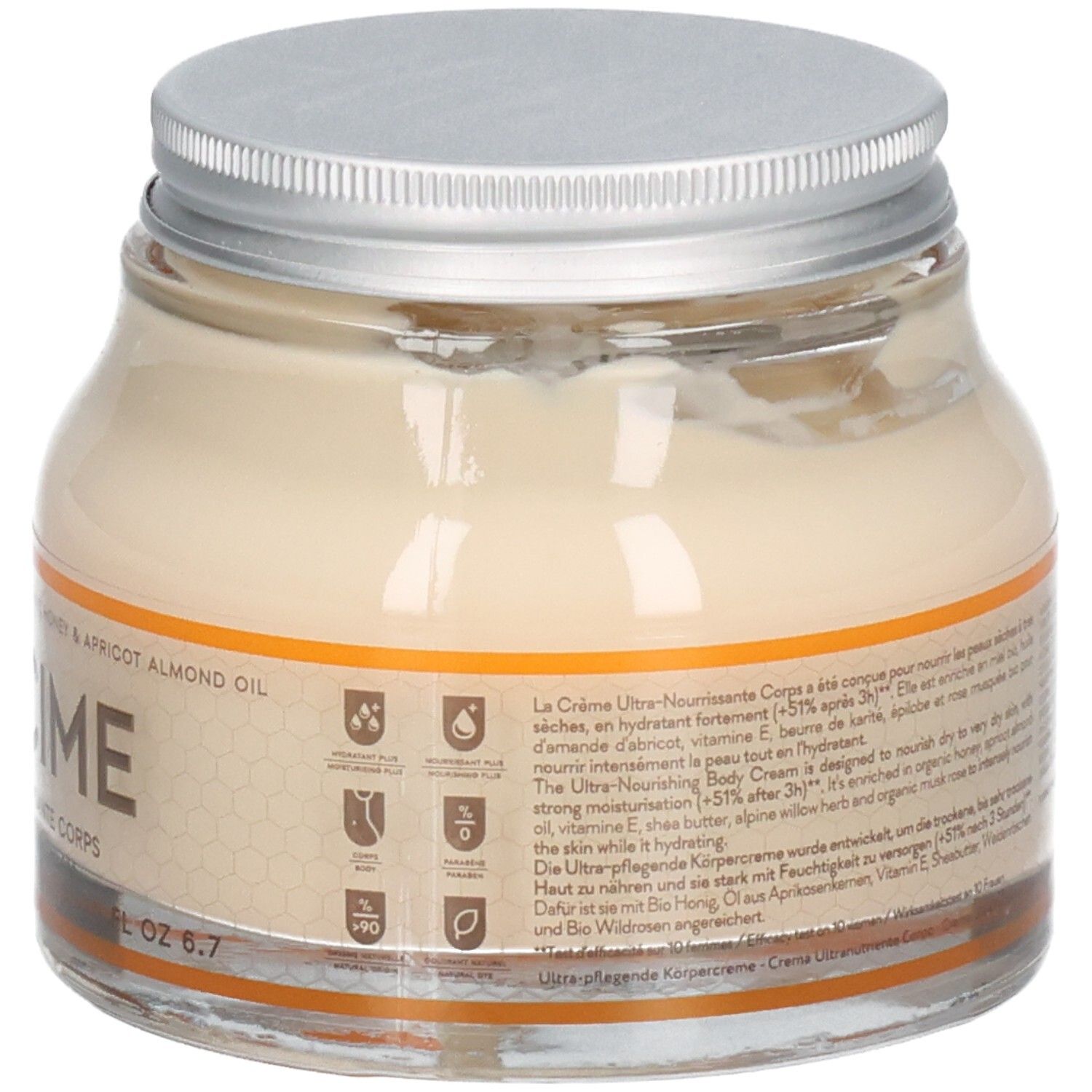 Pot en verre avec crème. Couvercle argenté. Inscription: Mielicime, Crème ultra-nourrissante corps. Huile de miel et d'abricot. 6.7 fl oz.