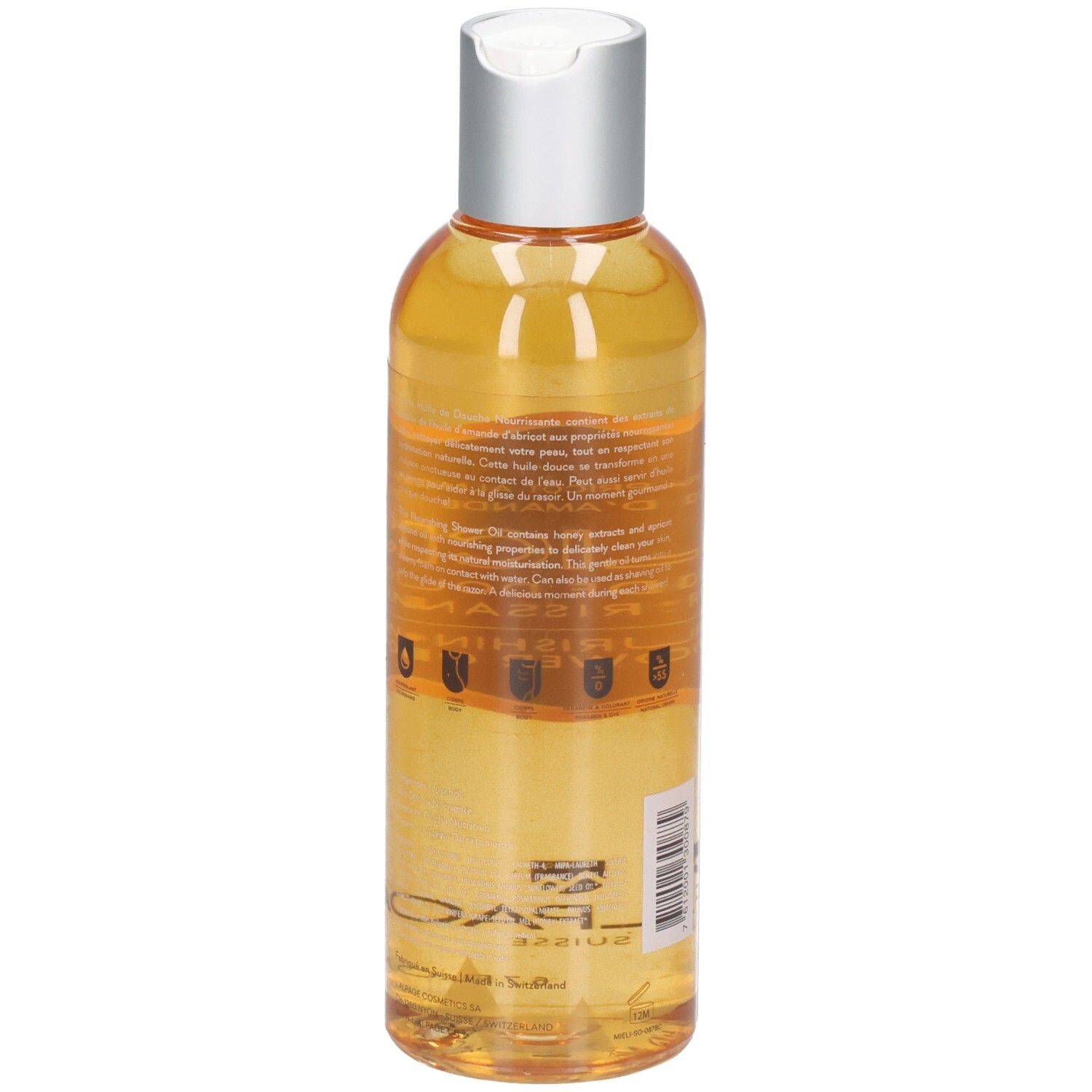Klare, gelbe Duschölflasche mit silbernem Klappverschluss. Etikett mit Text und Symbolen.