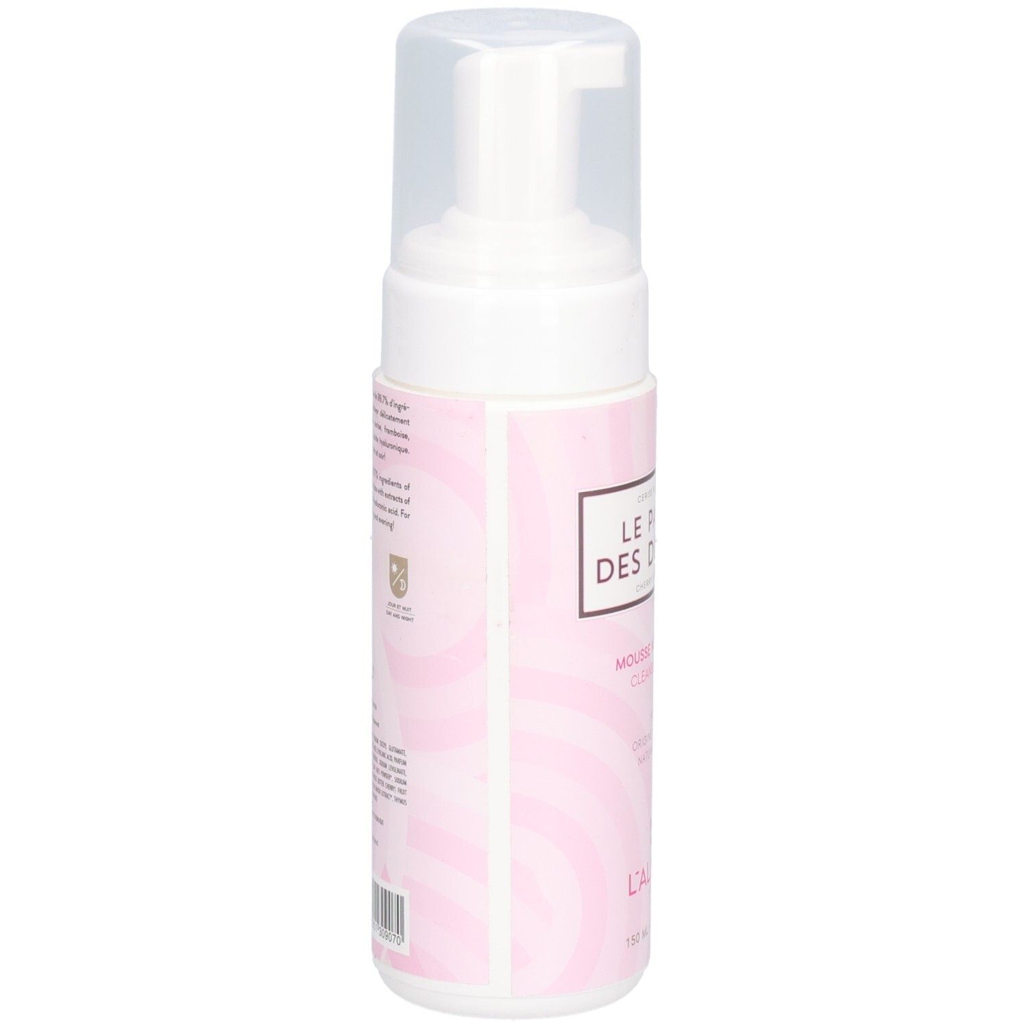Flacon de mousse nettoyante, vue latérale. Distributeur blanc avec bouchon transparent. Étiquette rose avec texte.