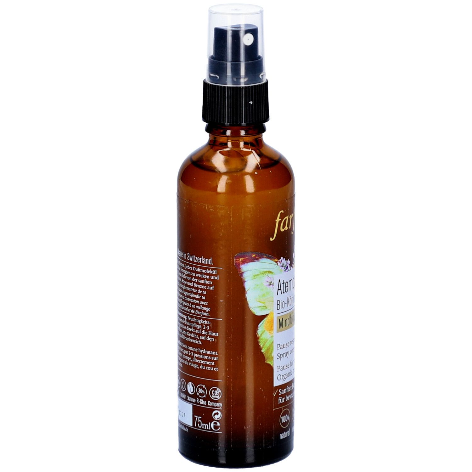 Flacon en verre brun avec vaporisateur. Dos avec texte et logos. Inscription : 75ml, Fabriqué en Suisse.