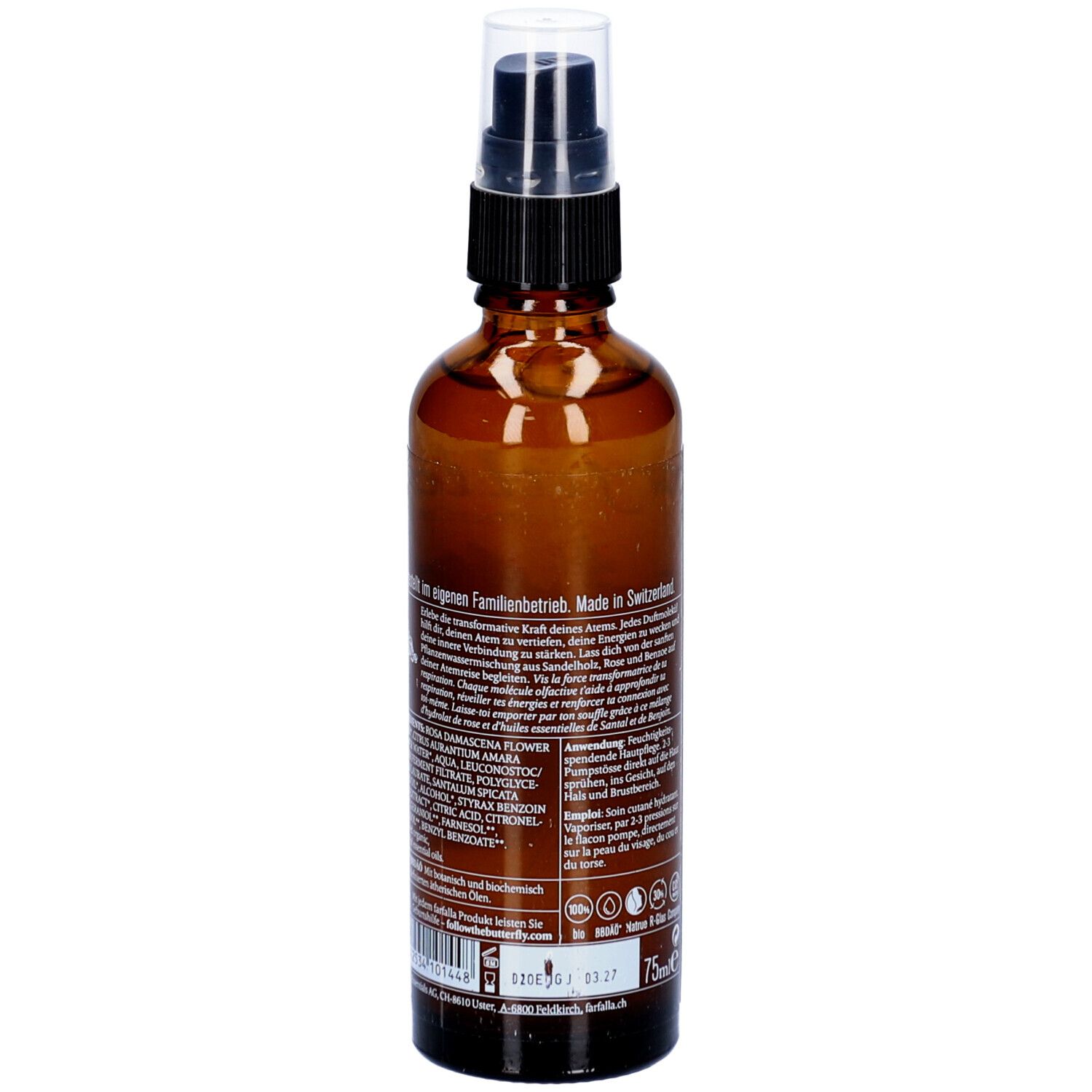 Flacon en verre brun avec vaporisateur. Dos avec texte. Inscription : Dans une entreprise familiale. Fabriqué en Suisse.