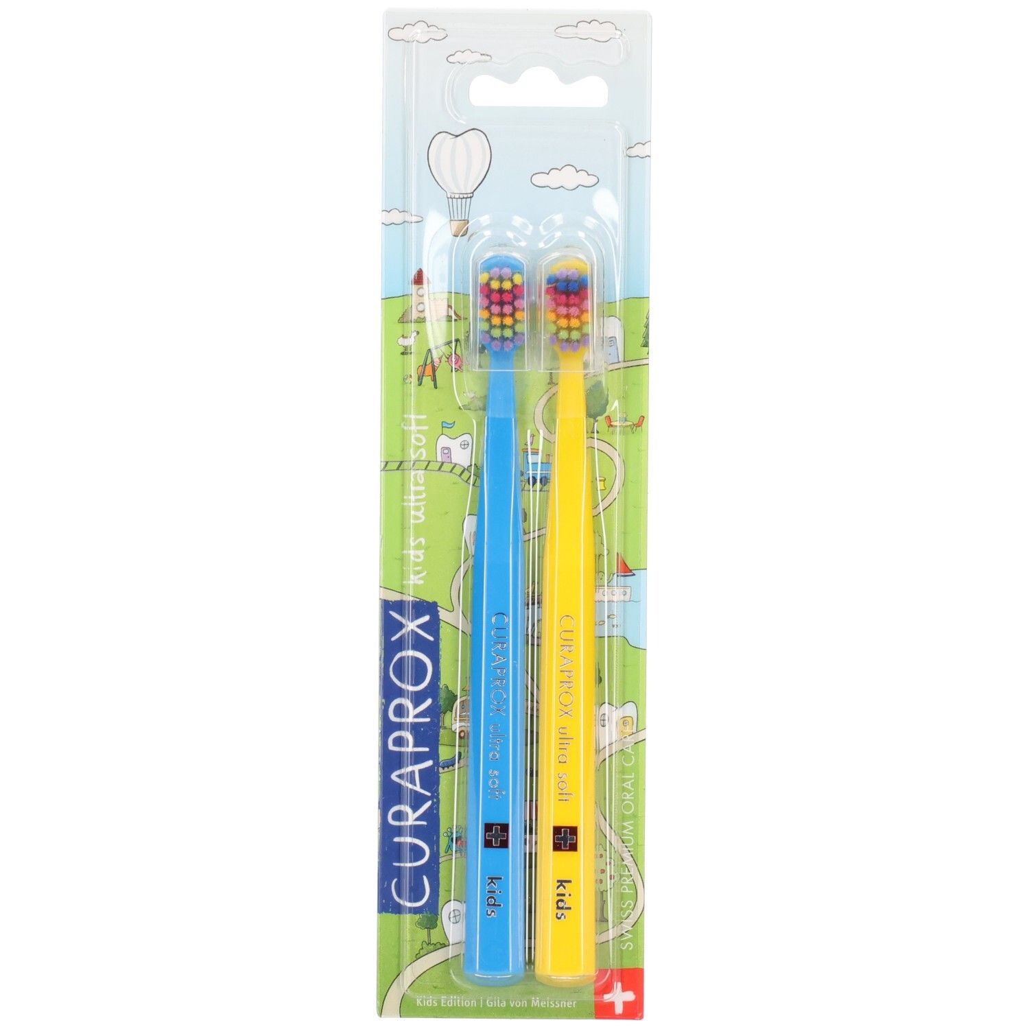 Zwei blaue und gelbe Zahnbürsten in Blisterverpackung. CURAPROX Kids Ultra Soft, farbige Borsten.