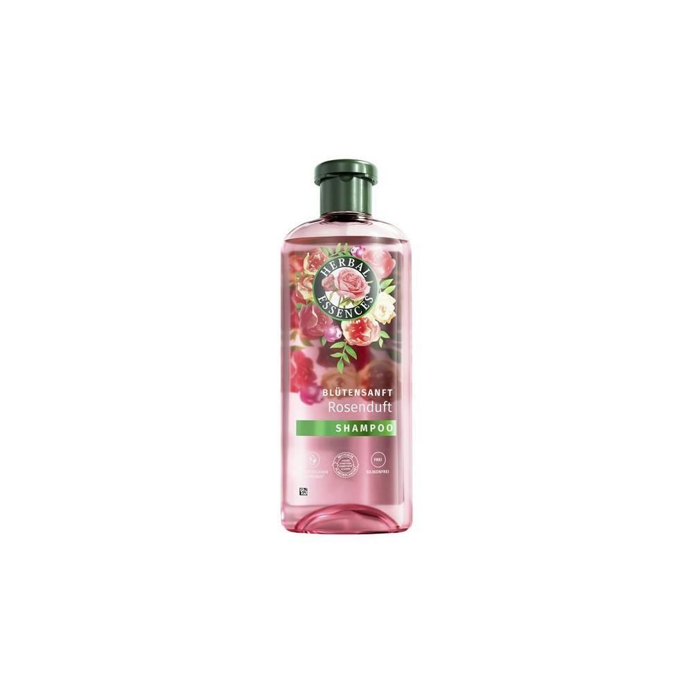 Rosafarbenes Shampoo in einer Flasche mit grünem Deckel. Etikett mit Blumenmotiv und Schriftzug 'Blütensanft Rosenduft Shampoo'.