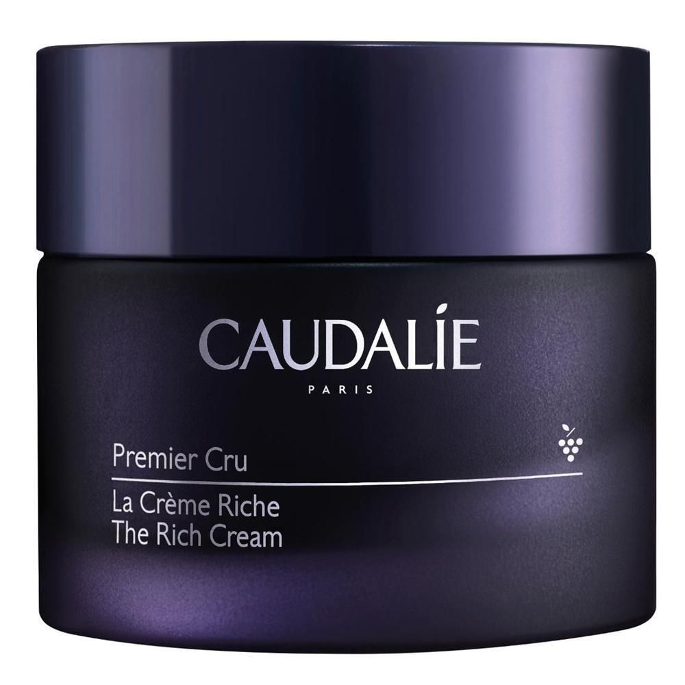 Dunkelblaue Creme-Dose mit Deckel. Aufschrift: Caudalie, Premier Cru, La Crème Riche, The Rich Cream. Trauben-Symbol.