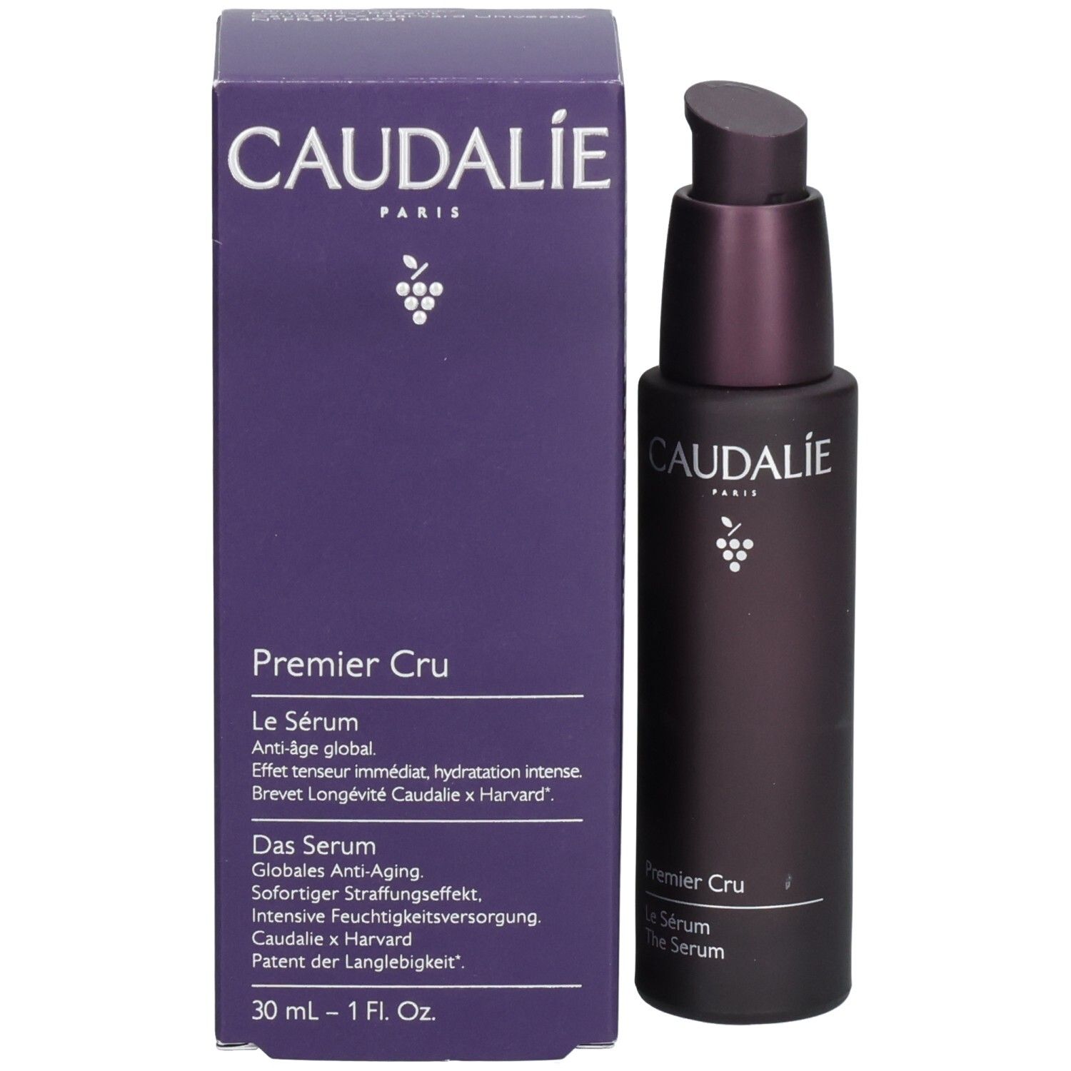 Dunkelviolette Flasche mit Pumpe neben einer violetten Schachtel. Caudalie Premier Cru Le Sérum.