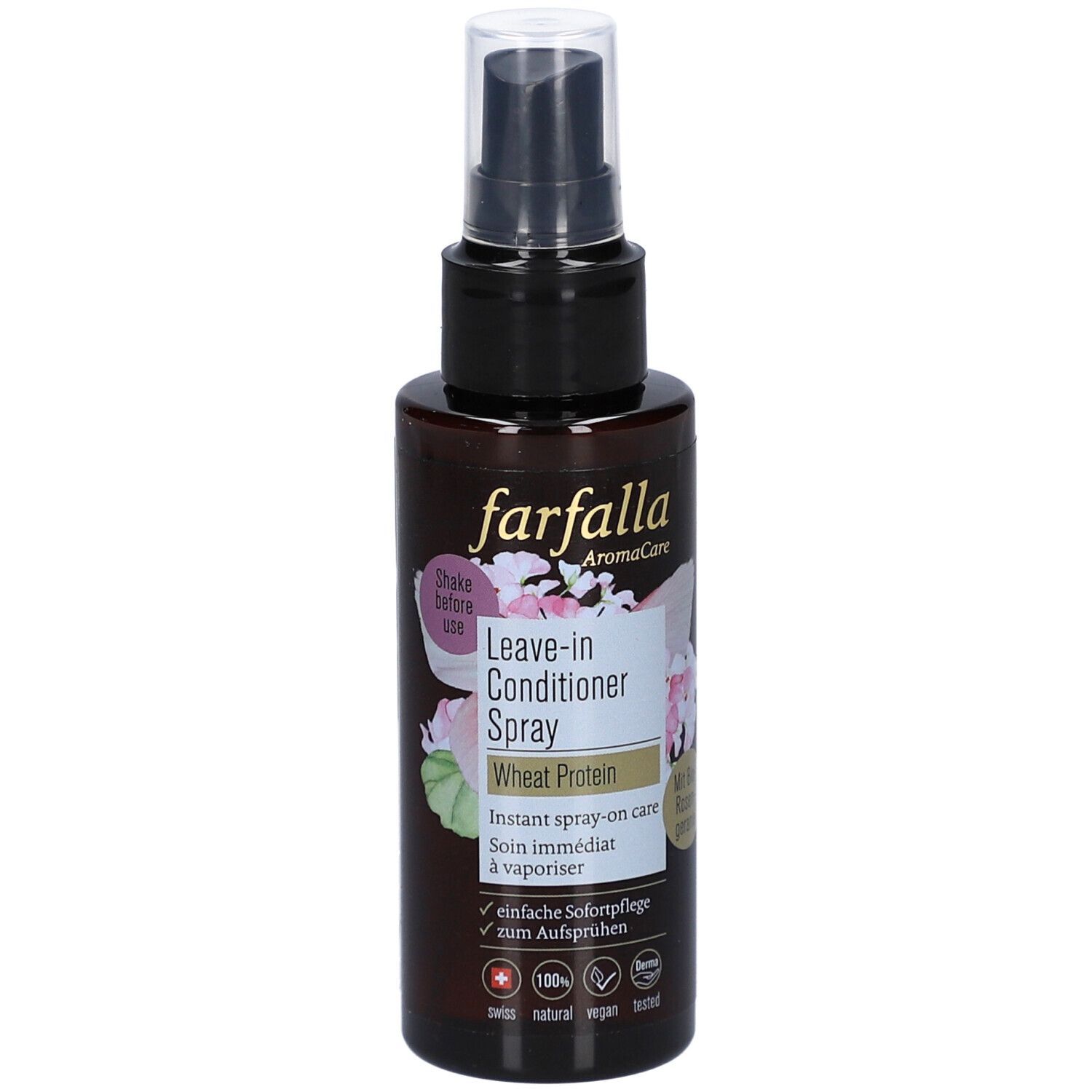 Flacon spray brun avec tête noire. Inscription: farfalla, Leave-in Conditioner Spray, Wheat Protein. Décor floral.
