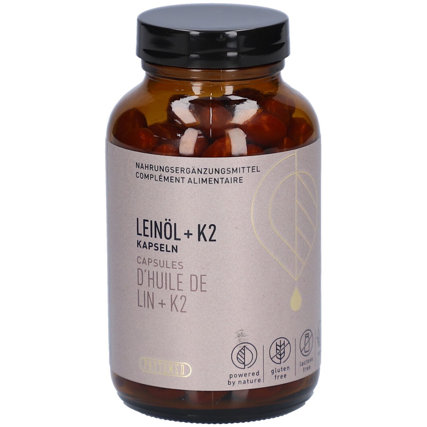 Flacon en verre brun avec bouchon noir. Étiquette avec nom du produit: Leinöl + K2 Kapseln. Sans gluten, sans lactose.
