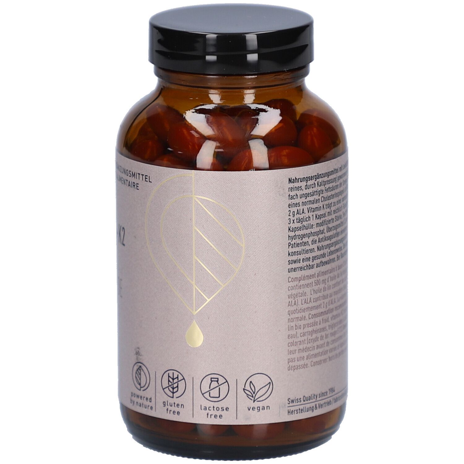 Dos du flacon en verre brun. Étiquette avec informations sur le produit. Sans gluten, sans lactose, vegan. Swiss Quality.