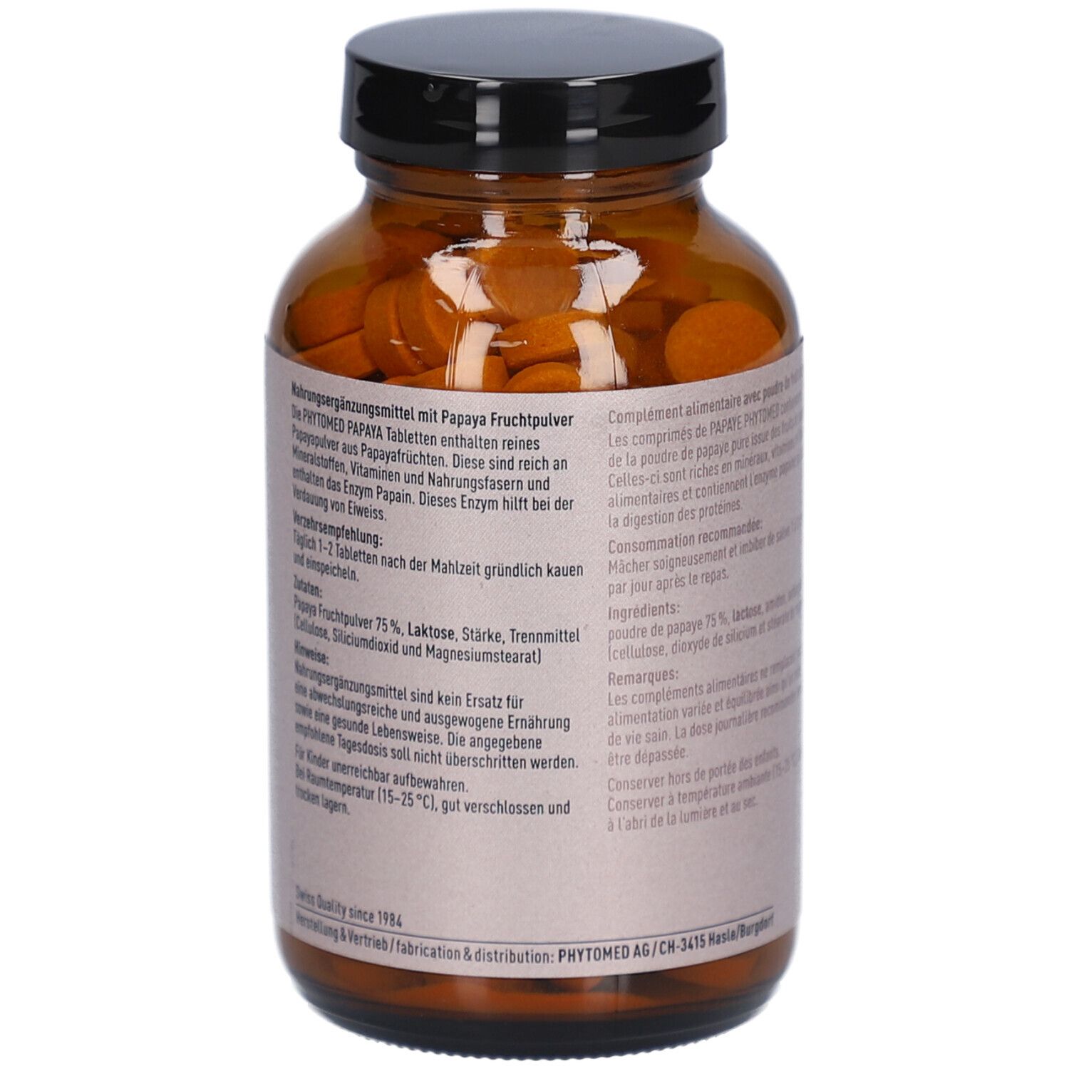 Rückseite der braunen Glasflasche mit Papaya Tabletten. Text in Deutsch und Französisch. Inhaltsstoffe und Anwendungshinweise.