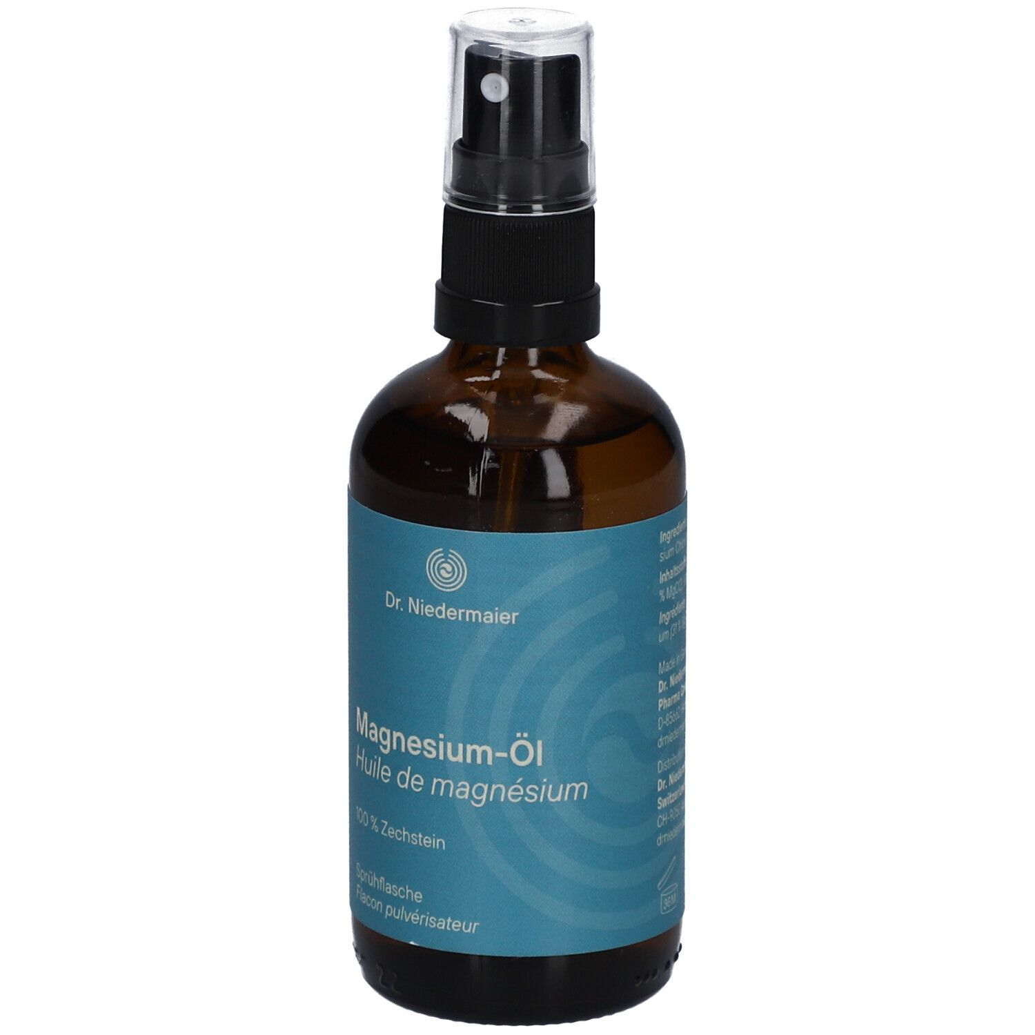 Braune Sprühflasche mit blauem Etikett. Aufschrift: Magnesium-Öl, Dr. Niedermaier. Mit Zerstäuber.