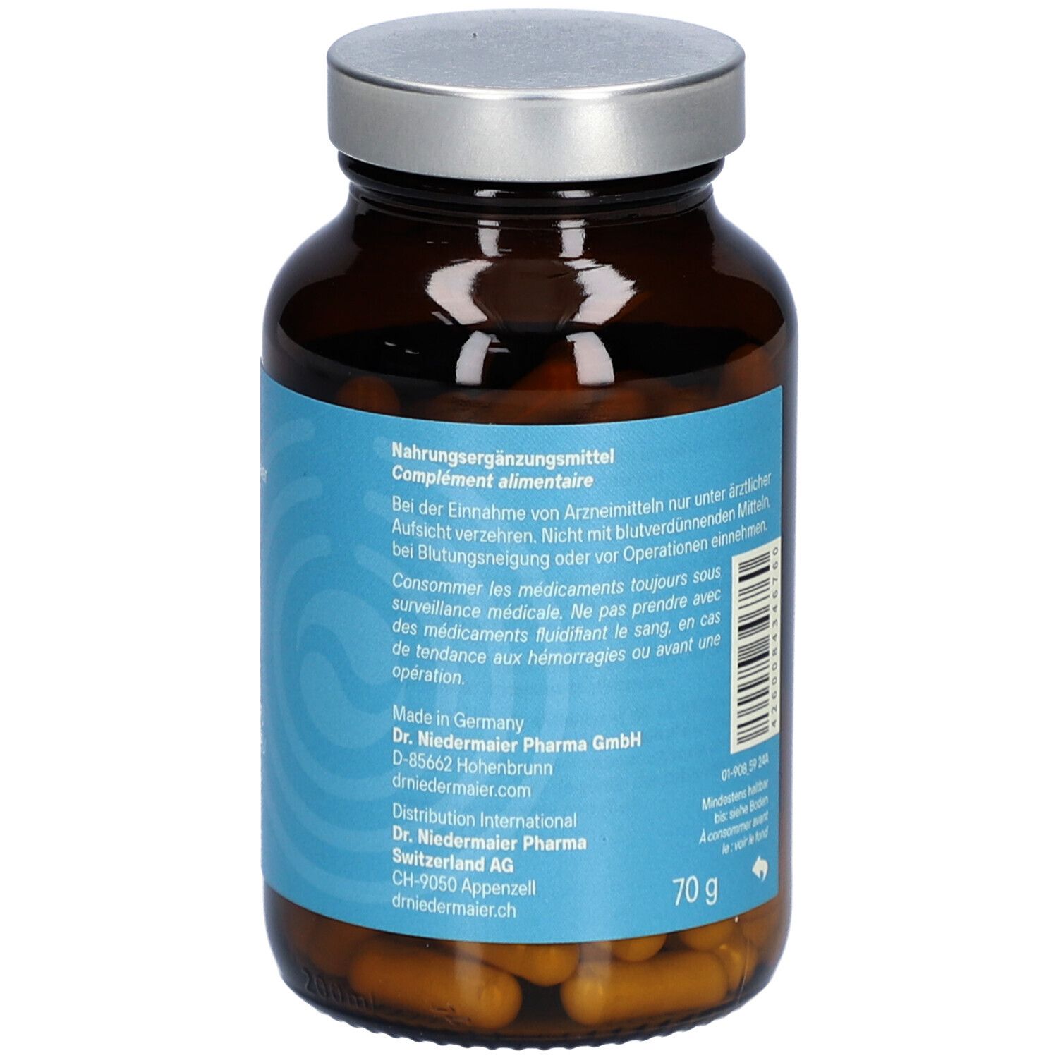 Flacon en verre brun avec couvercle argenté. Étiquette avec informations produit et adresse fabricant. Contenu 70g.