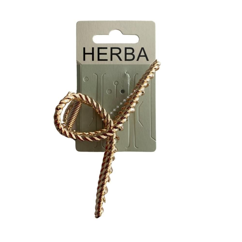 Haarspange HERBA, goldfarbenes Metall. Auf Pappkarte. Geflochtenes Design, Loop-Form.