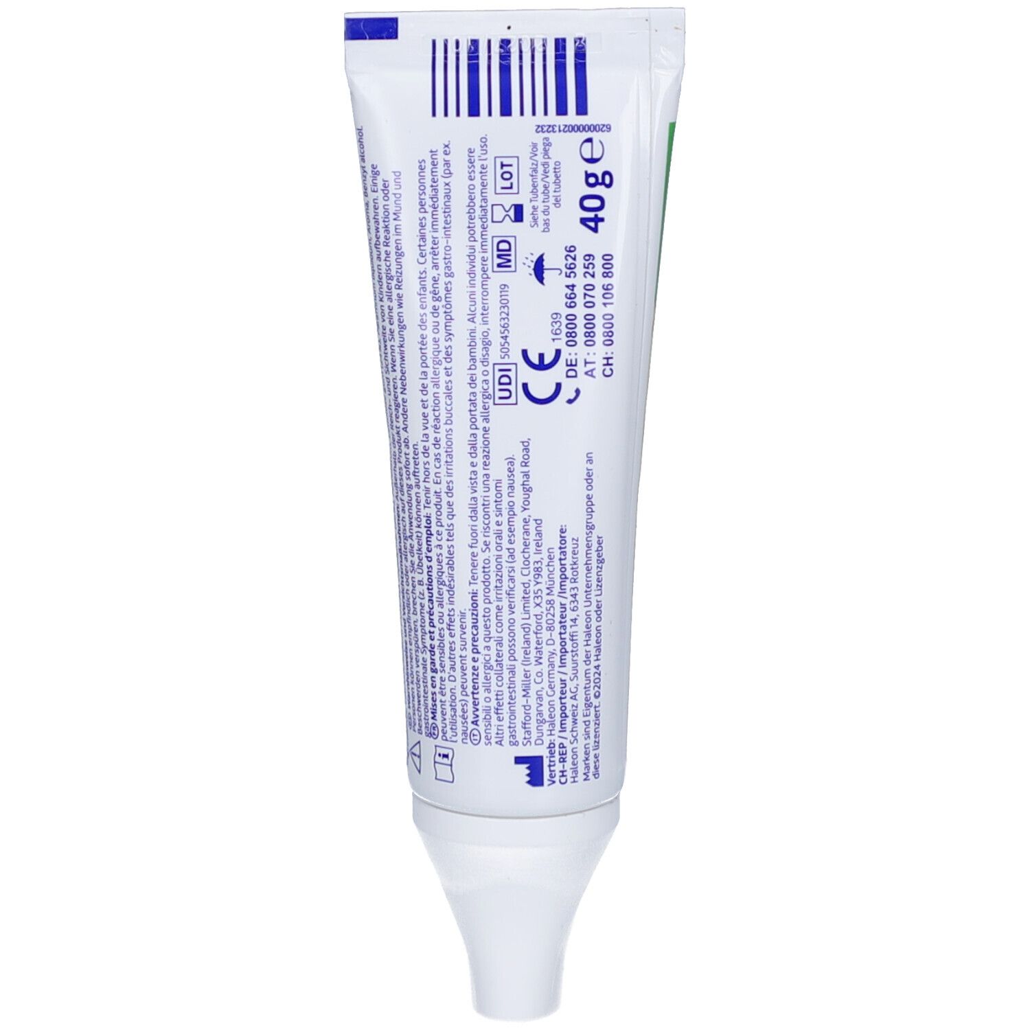 Rückseite der Zahncreme-Tube. Enthält Informationen, Barcode, CE-Kennzeichnung und Kontaktinformationen. Weiße Tube.