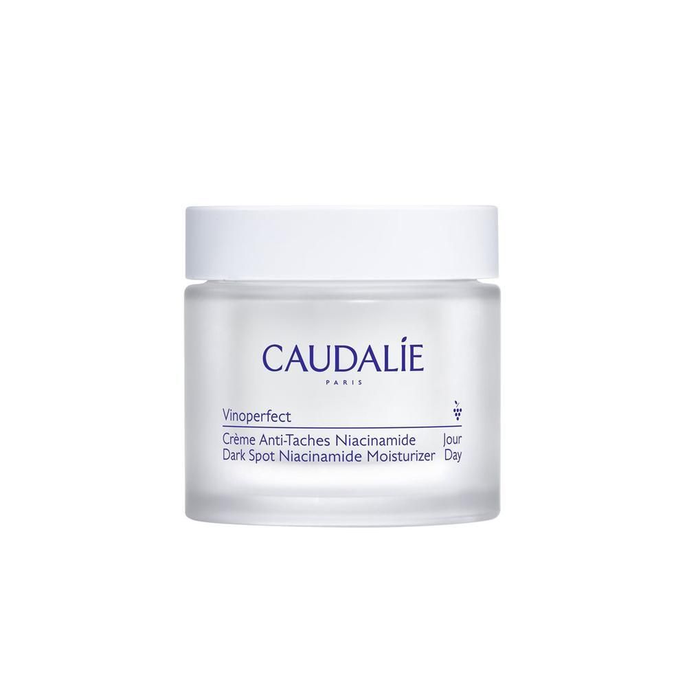 Pot de crème avec couvercle blanc. Inscription CAUDALIE PARIS. Nom du produit : Vinoperfect Crème Anti-Taches Niacinamide.