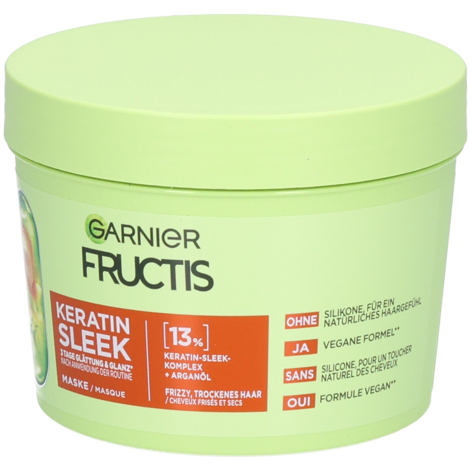 Garnier Fructis Keratin Sleek Maske: Hellgrüner Tiegel mit orangefarbenem Etikett, vegane Formel.