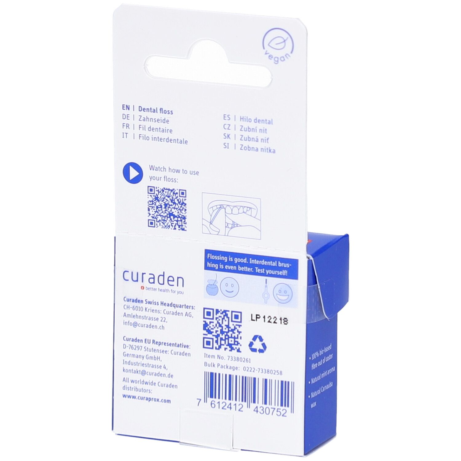 Dos de l'emballage bleu. Texte multilingue. Code QR et informations fabricant. Label vegan.