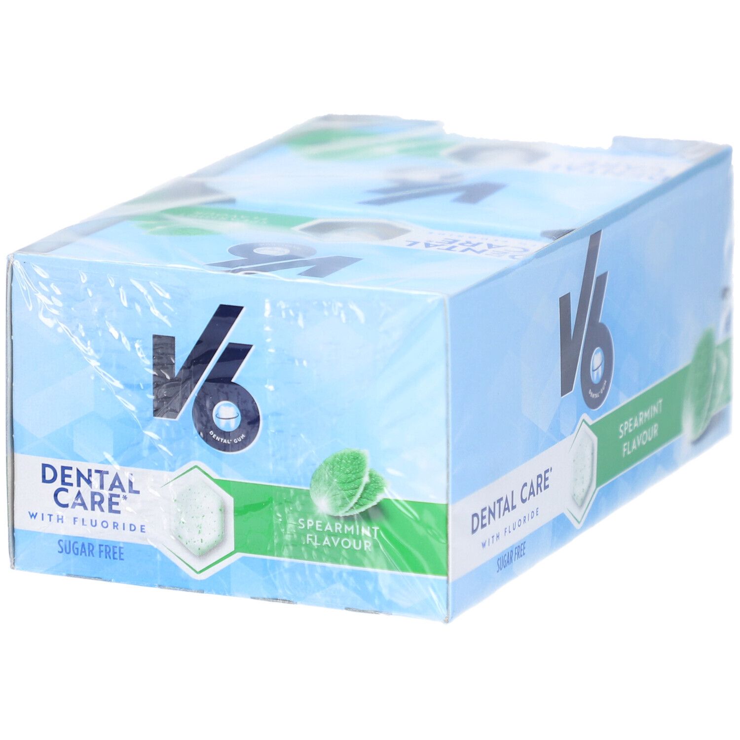 Verpackung mit V6 Kaugummi. Aufschrift: Dental Care, Spearmint Flavour, Sugar Free. Mint-Blätter und hexagonale Form.