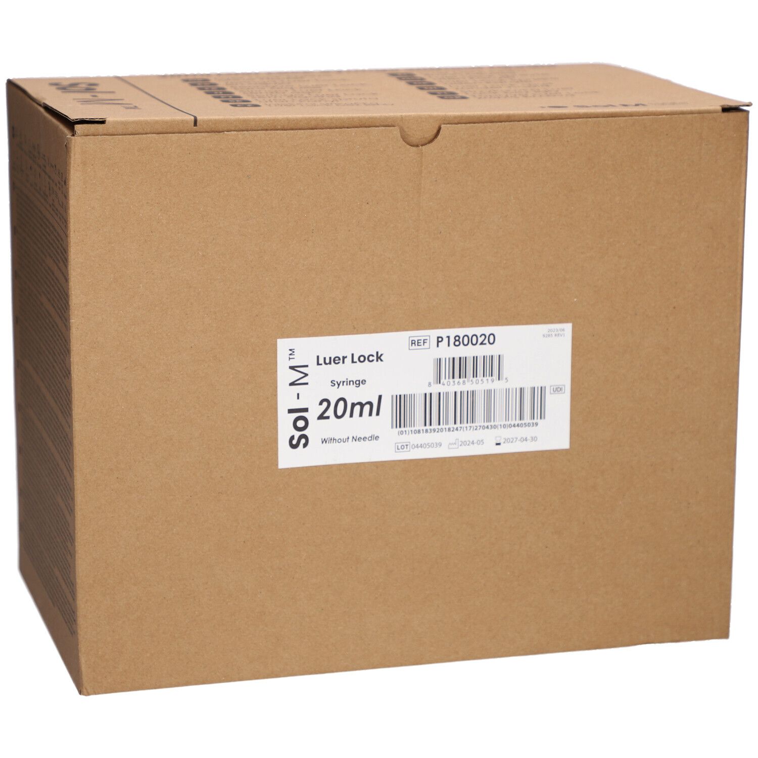 Karton mit Etikett. Beschriftung: Sol-M Luer Lock Spritze 20ml ohne Nadel. Referenznummer und Barcode.