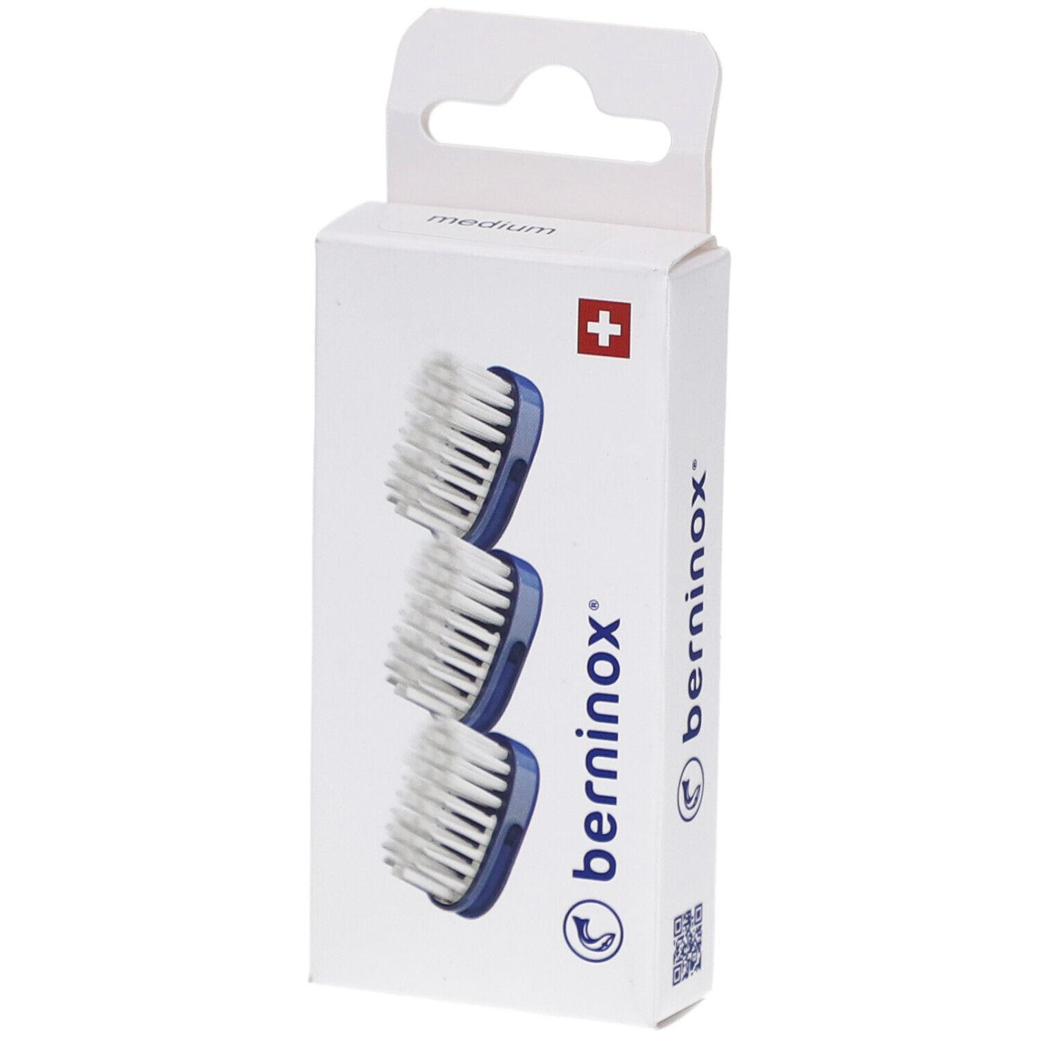 Emballage de 3 têtes de brosse à dents. Support bleu, poils blancs. Marque Berninox, croix suisse.