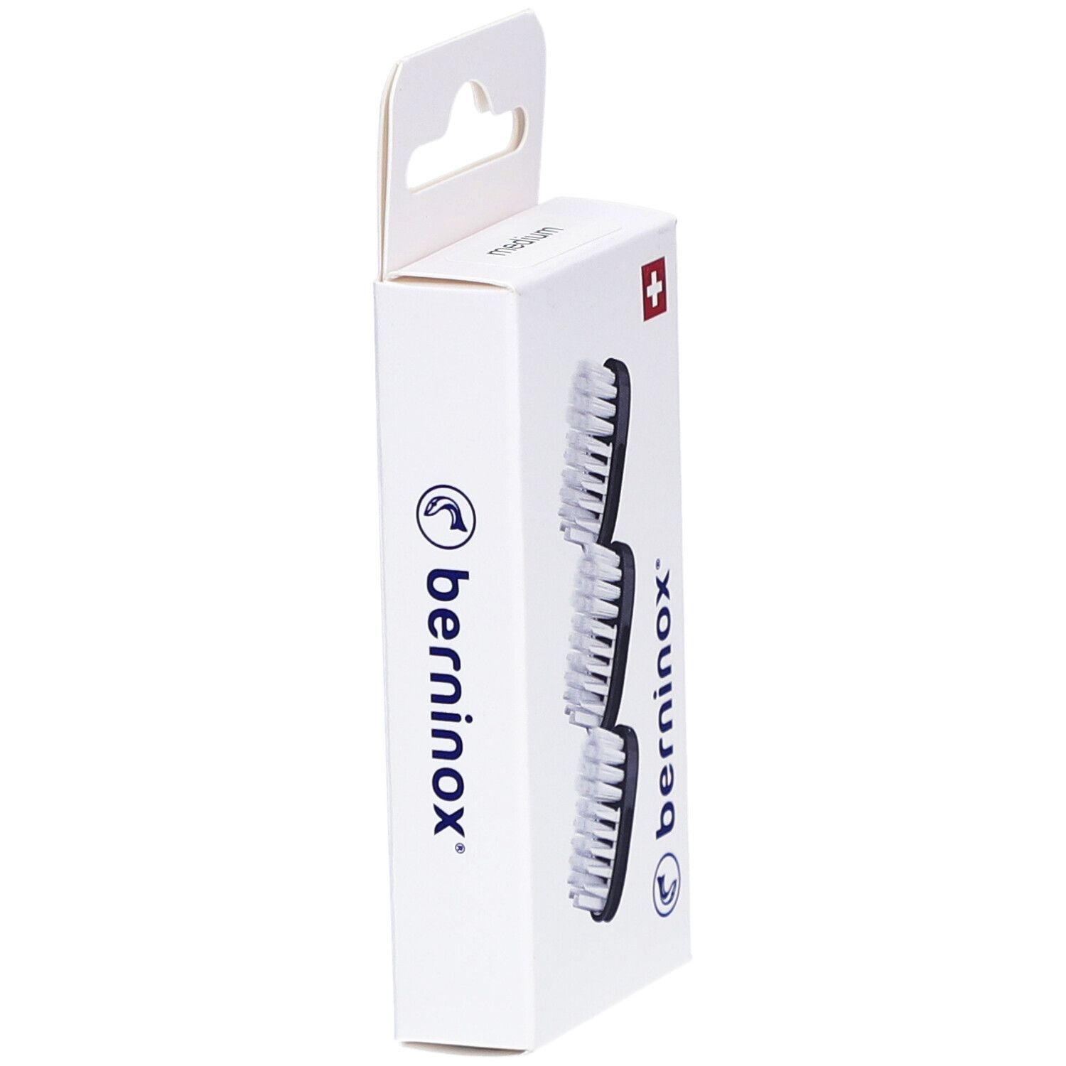 Vue latérale de la boîte avec 3 têtes de brosse de rechange. Marque Berninox, croix suisse.