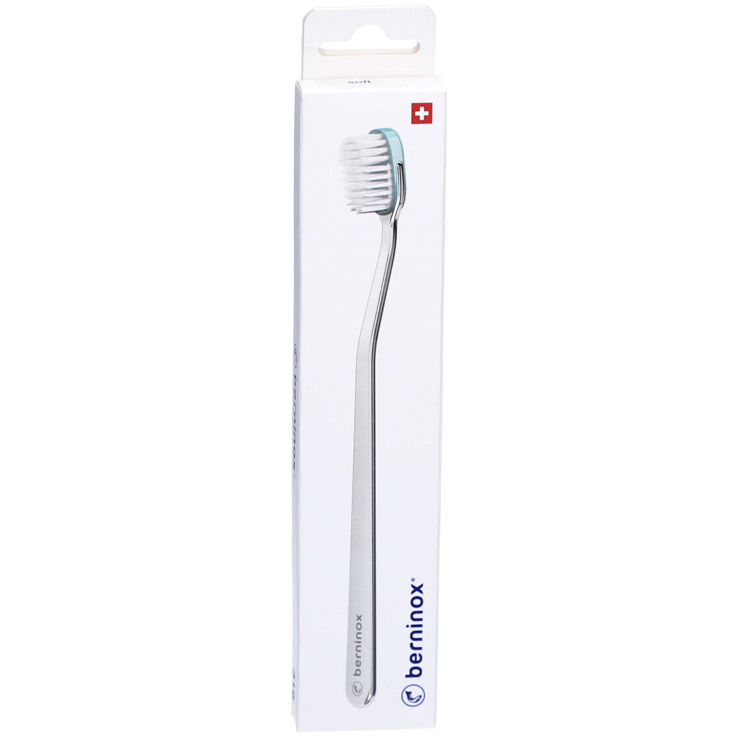 Brosse à dents Eisberggrün Soft dans son emballage. Manche blanc, tête bleue. Croix suisse en haut.