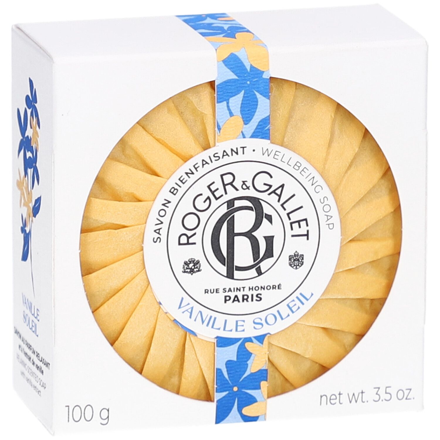 Savon rond dans son emballage. Inscription: Roger & Gallet Vanille Soleil. Ruban fleuri.