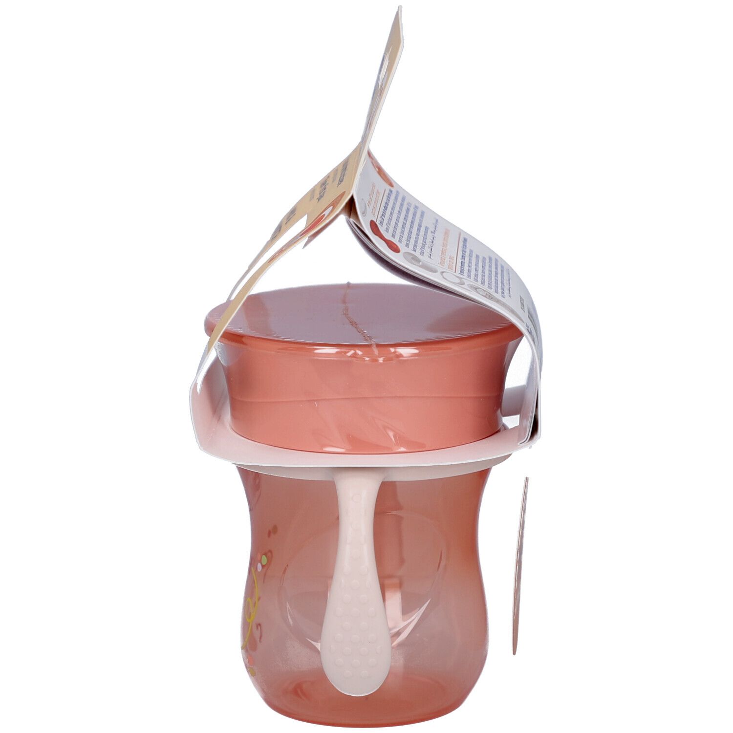 Seitenansicht des rosa Trinkbechers mit Griffen. Verpackung mit Produktinformationen.