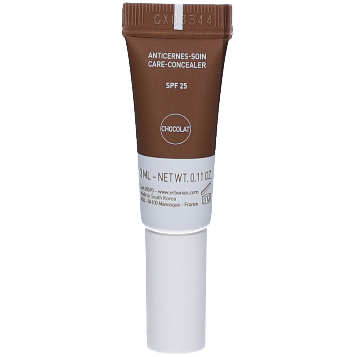 Tube marron et blanc. Inscriptions: ANTICERNES-SOIN CARE-CONCEALER, SPF 25, CHOCOLAT. Produit pour les yeux.