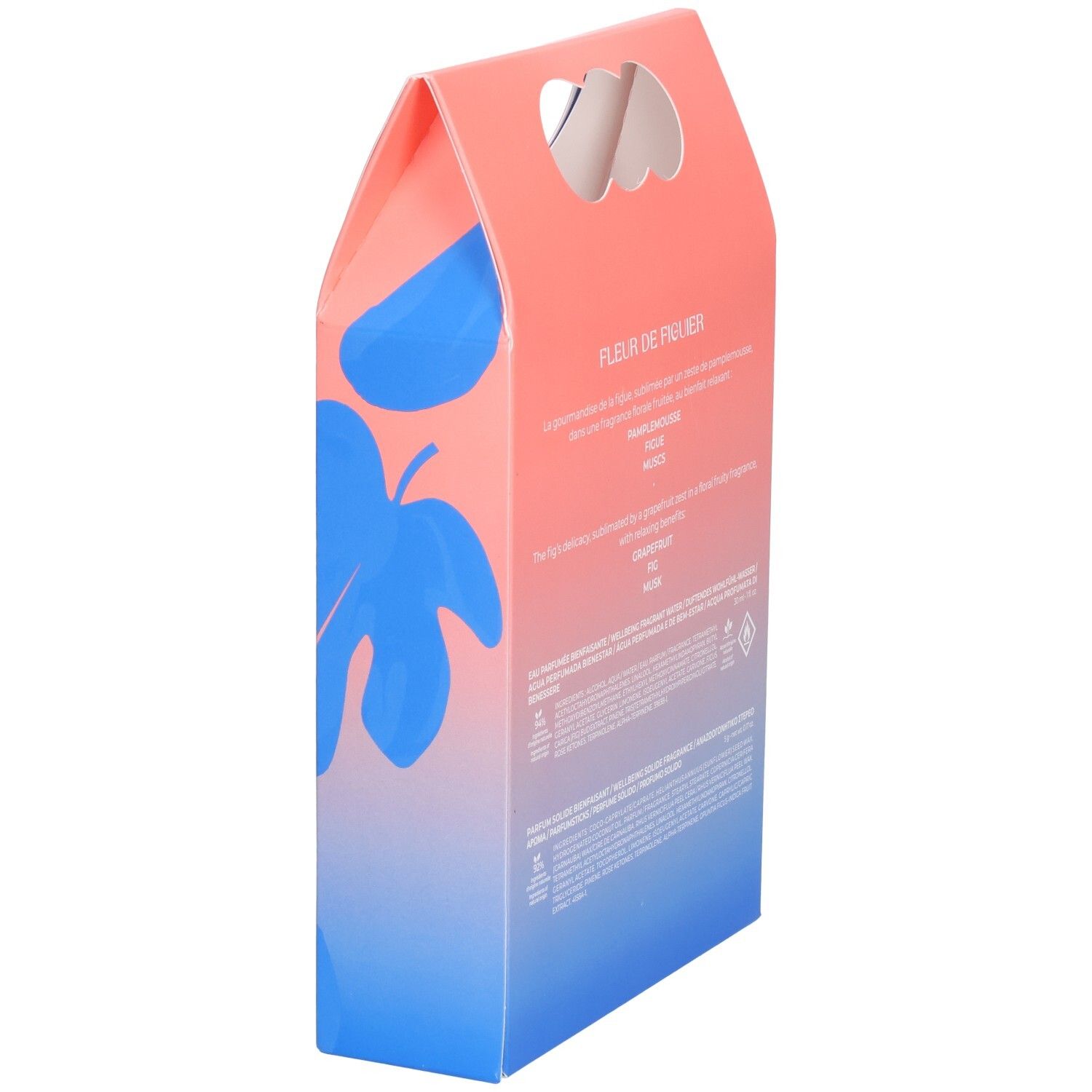 Vue latérale du coffret cadeau. Emballage rose et bleu avec nom du produit. Texte et logo visibles.