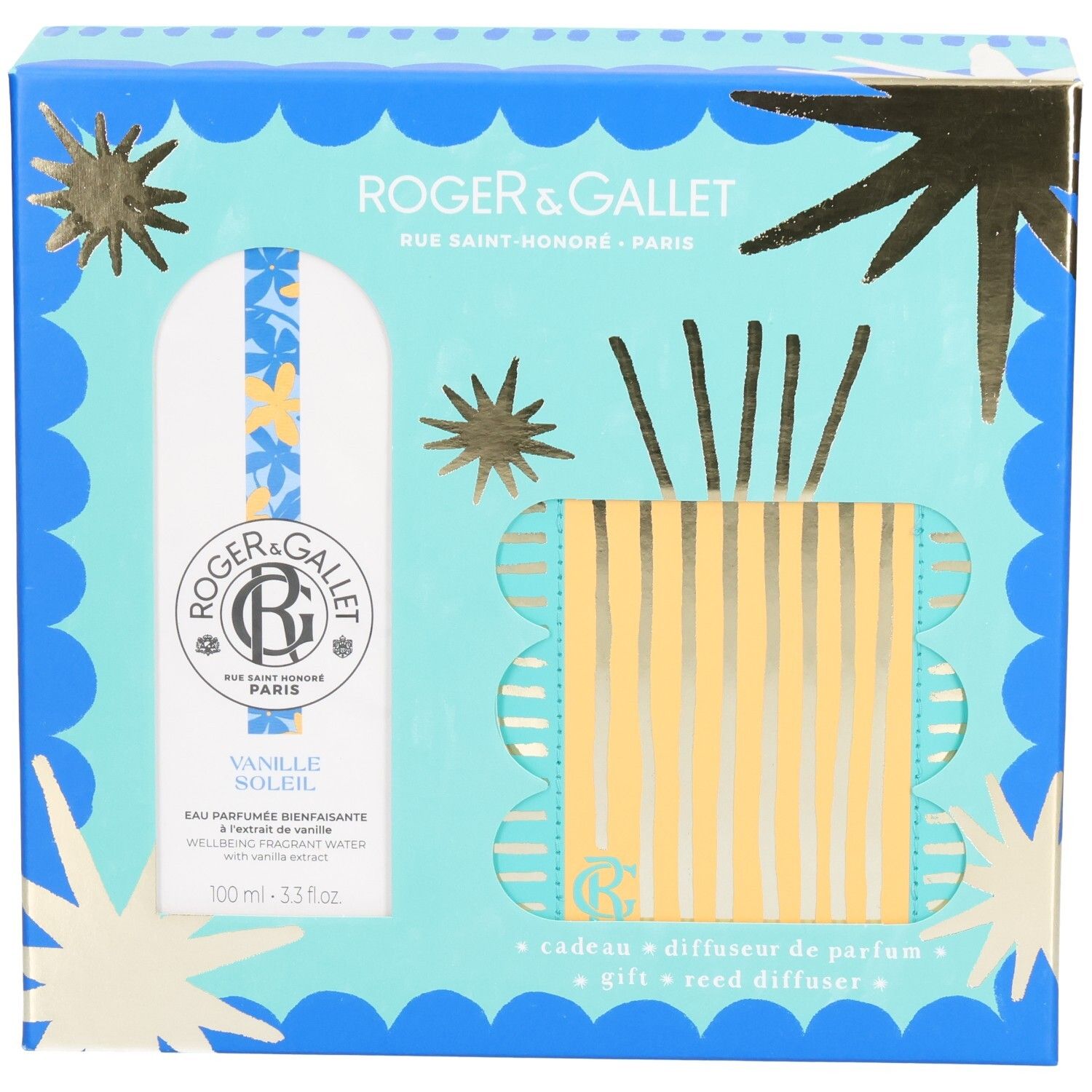Coffret cadeau avec diffuseur de parfum. Emballage bleu clair et doré avec images de produits. Contient flacon et diffuseur à bâtonnets.