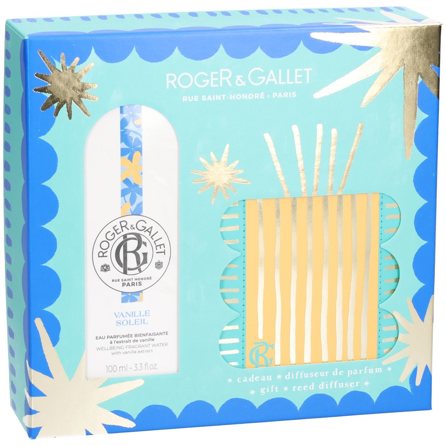 Coffret cadeau avec diffuseur de parfum. Emballage bleu clair et doré avec images de produits. Contient flacon et diffuseur à bâtonnets.