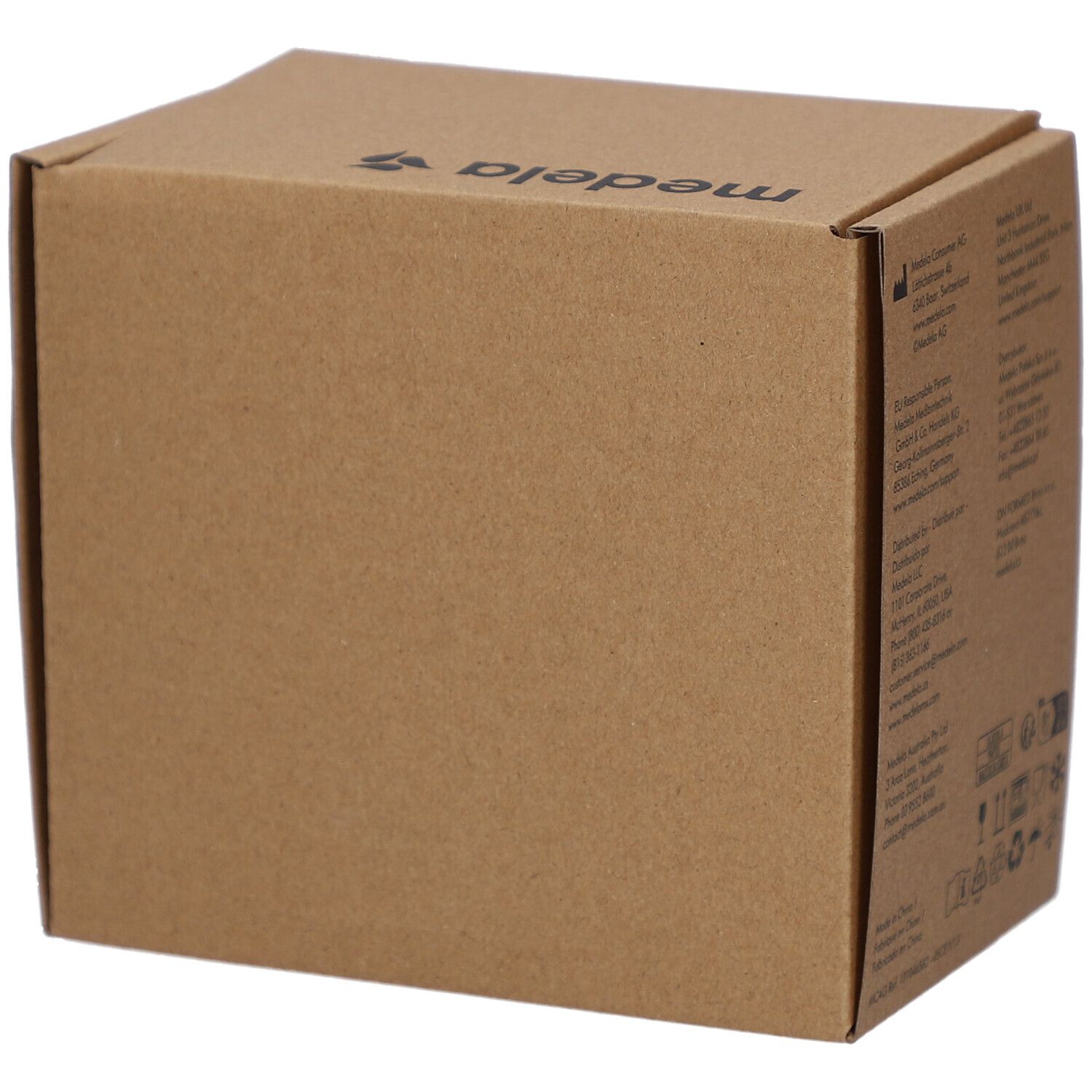 Boîte en carton marron. Logo Medela. Vue d'angle.