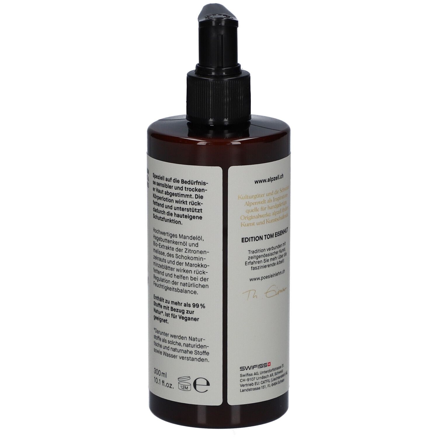 Flacon brun avec pompe noire. Étiquette avec texte. "Edition Tom Eisenhut". Drapeau suisse et logo.