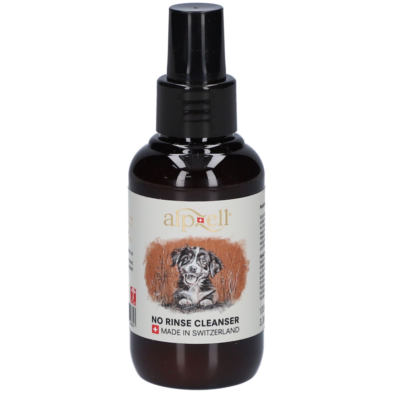 Flacon brun avec vaporisateur noir. Étiquette avec logo, chien et texte "NO RINSE CLEANSER". Fabriqué en Suisse.