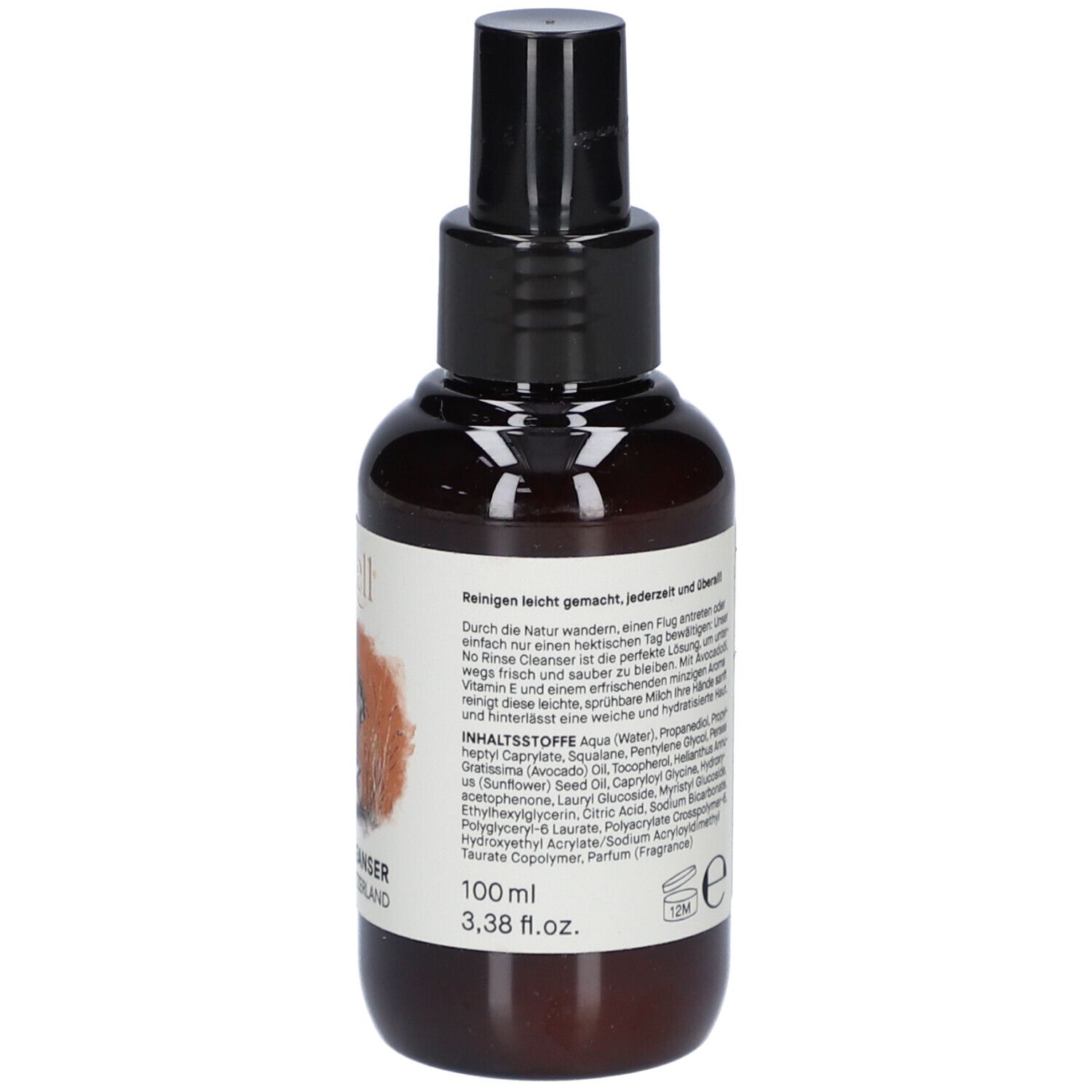 Flacon brun avec vaporisateur noir. Étiquette avec logo, chien, texte, ingrédients et volume : 100 ml.