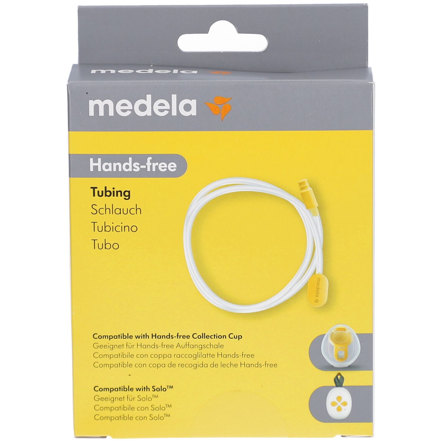 Verpackung mit Hands-free Tubing. Marke Medela. Gelber Hintergrund mit weißem Schlauch. Produktname und Logo sichtbar.