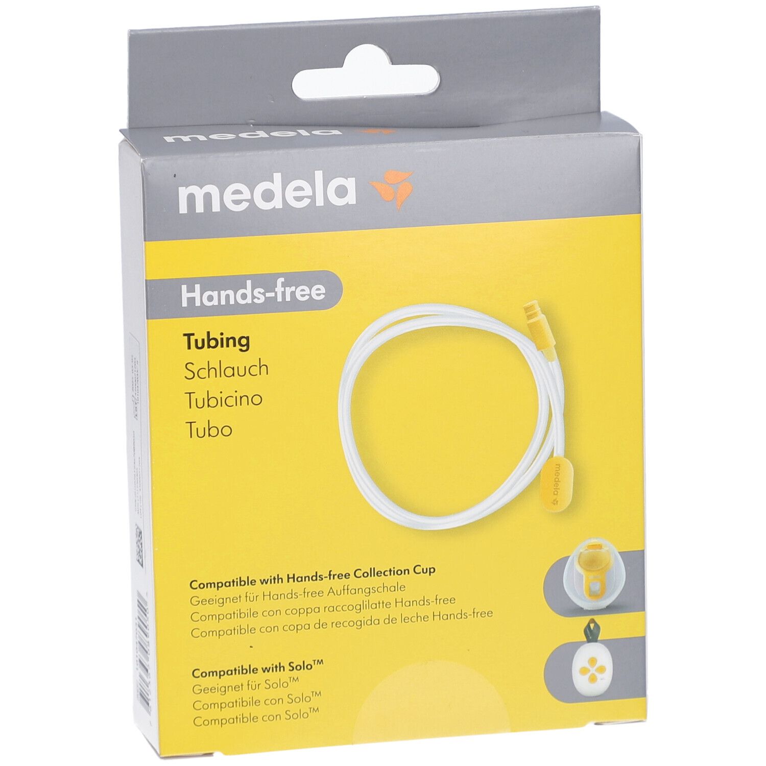 Verpackung mit Hands-free Tubing. Marke Medela. Gelber Hintergrund mit weißem Schlauch. Produktname und Logo sichtbar.
